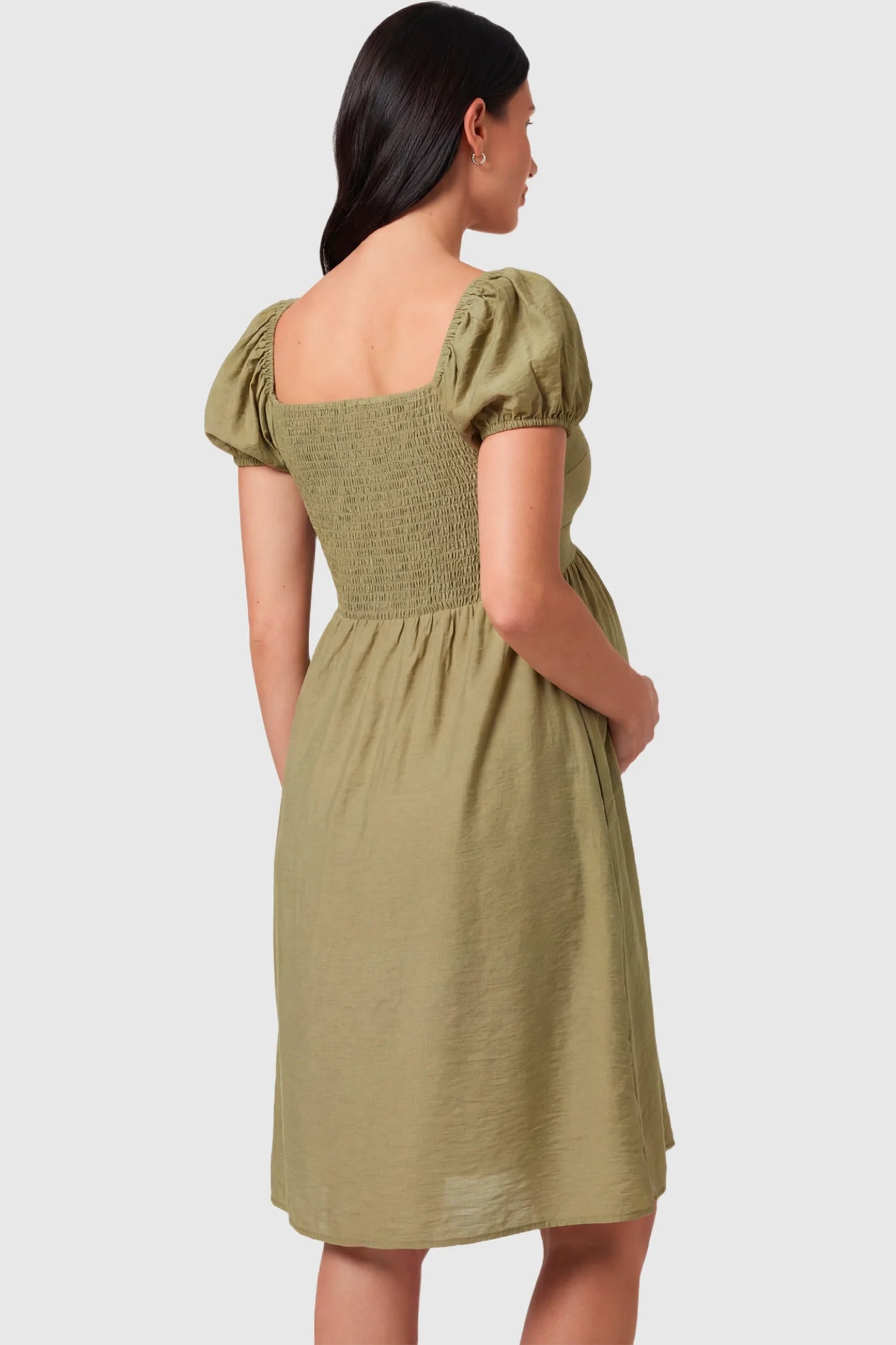 Short Puff Sleeve Empire Waist Maternity & Nursing Midi Dress Short Puff Sleeve Empire Waist Maternity & Nursing Midi Dress in olive green featuring a smocked bodice, and A-line silhouette on a pregnant model.