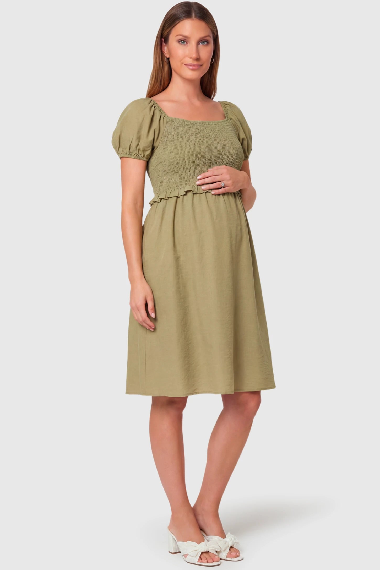 Short Puff Sleeve Empire Waist Maternity & Nursing Midi Dress in olive green featuring a square neck, smocked bodice, and A-line silhouette on a pregnant model.