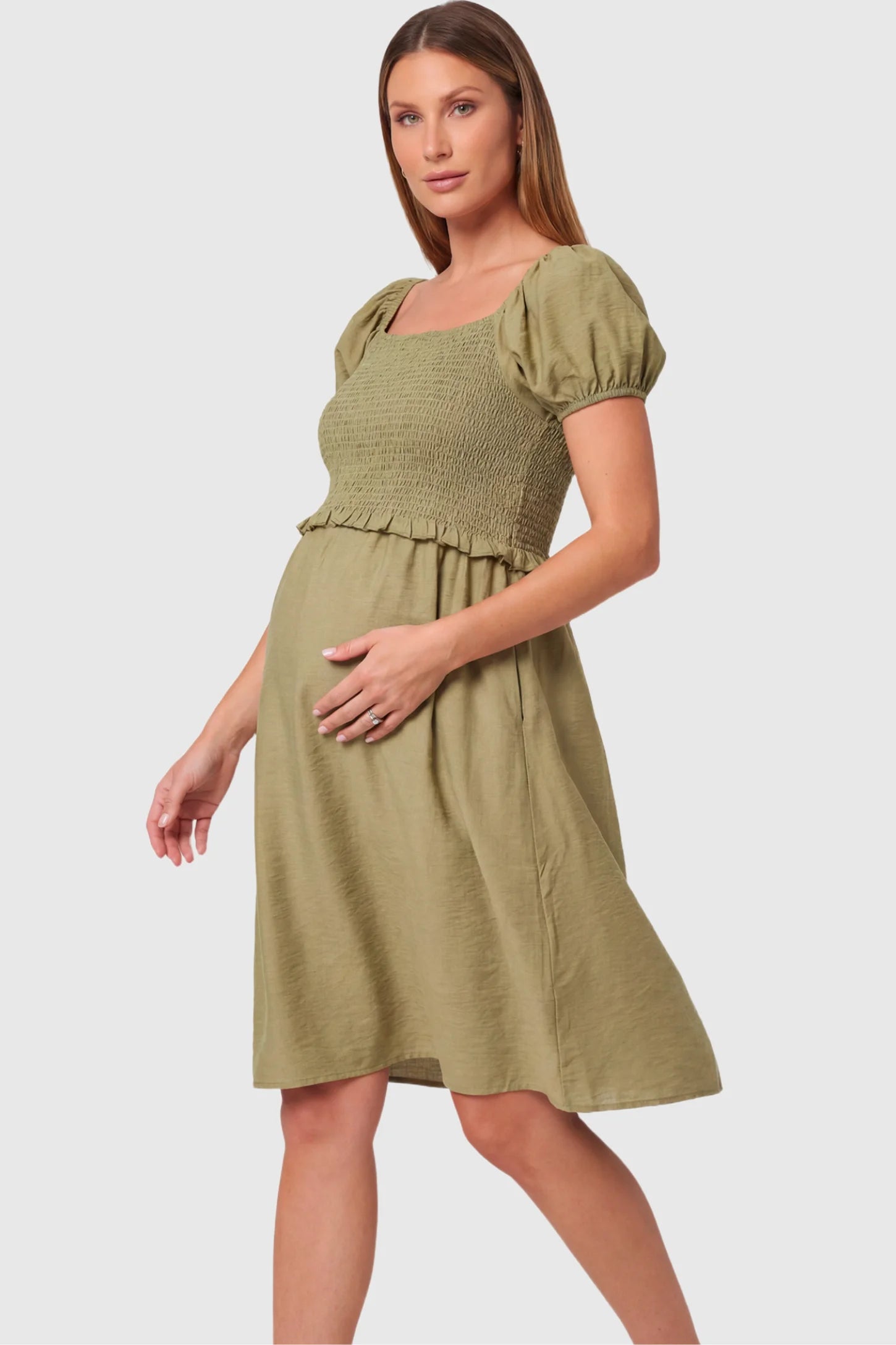 Short Puff Sleeve Empire Waist Maternity & Nursing Midi Dress in olive green featuring a square neck, smocked bodice, and A-line silhouette on a pregnant model.