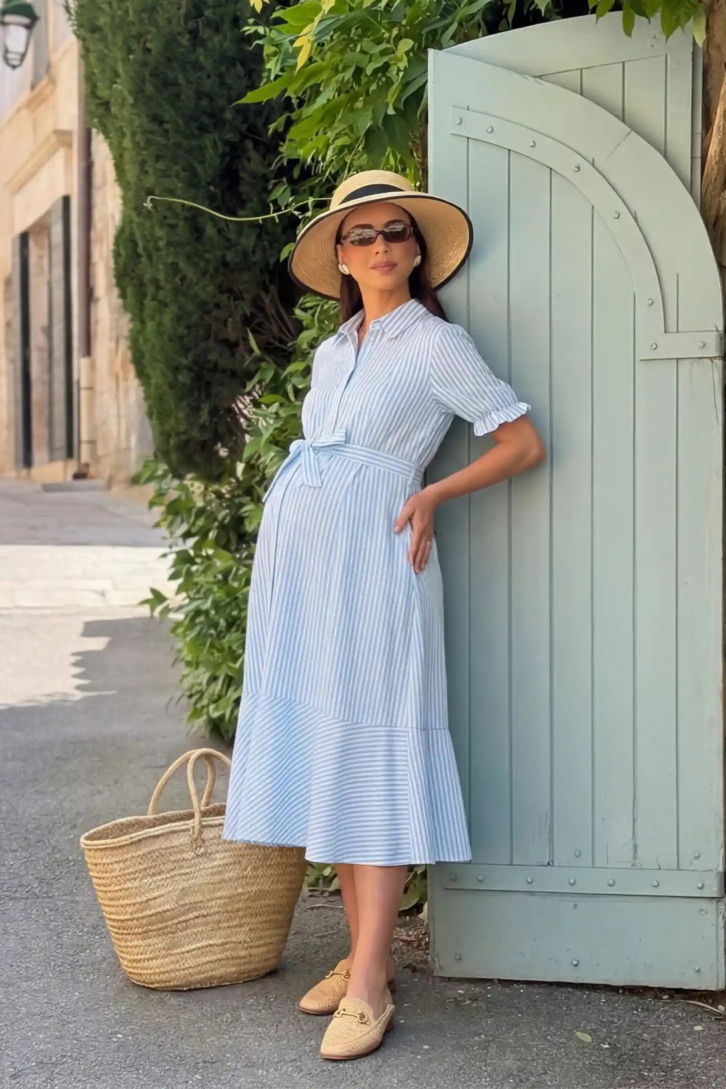 Striped Lapel Puff Sleeve A-Line Midi Maternity Dress Striped Lapel Puff Sleeve A-Line Midi Maternity Dress in Blue featuring waist tie bow in full body side view on a pregnant model