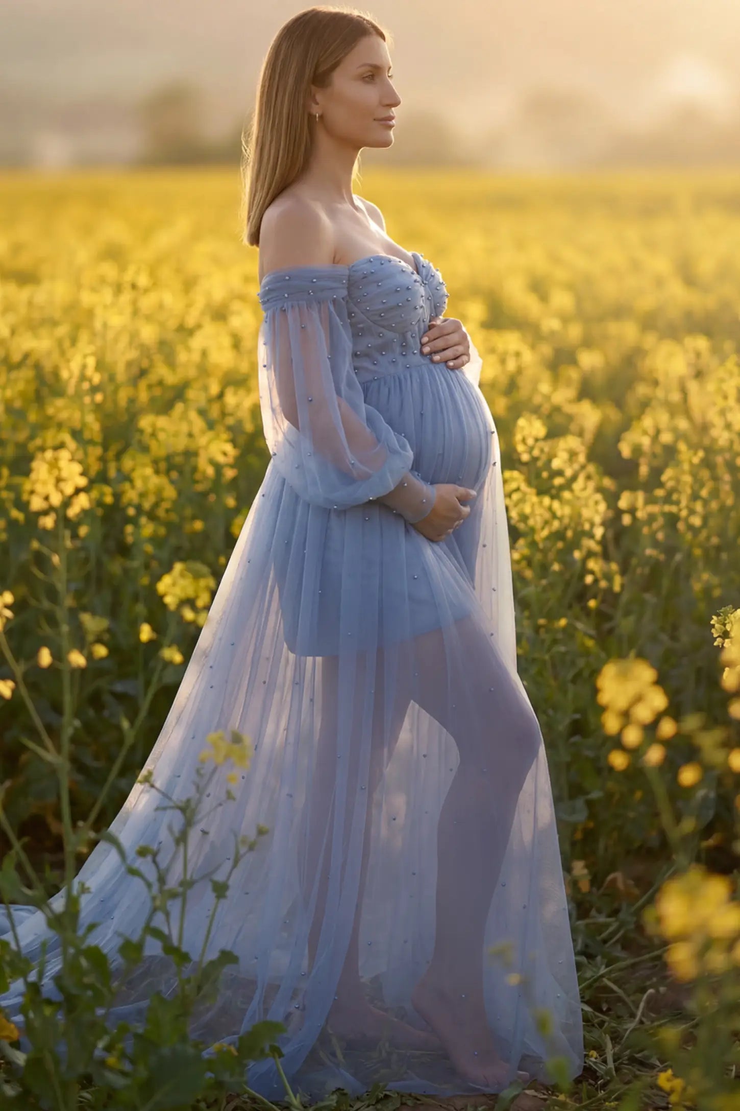 Off-Shoulder Empire Waist Maternity Gown Off-Shoulder Empire Waist Maternity Gown in blue featuring a sweetheart neckline and flowy A-line silhouette on a pregnant model, side view.