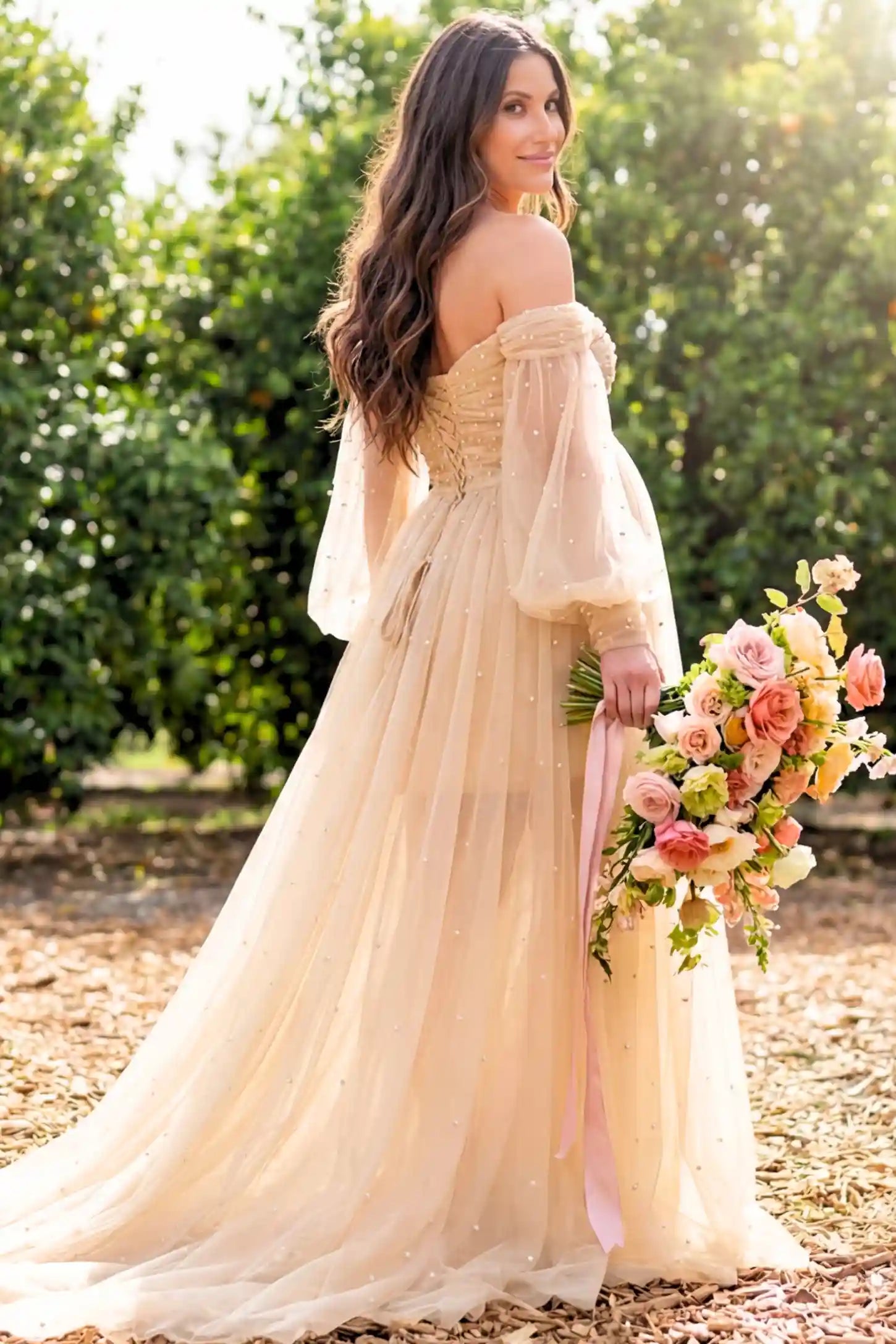 Off-Shoulder Empire Waist Maternity Gown Off-Shoulder Empire Waist Maternity Gown in camel featuring a sweetheart neckline and flowy A-line silhouette on a pregnant model.