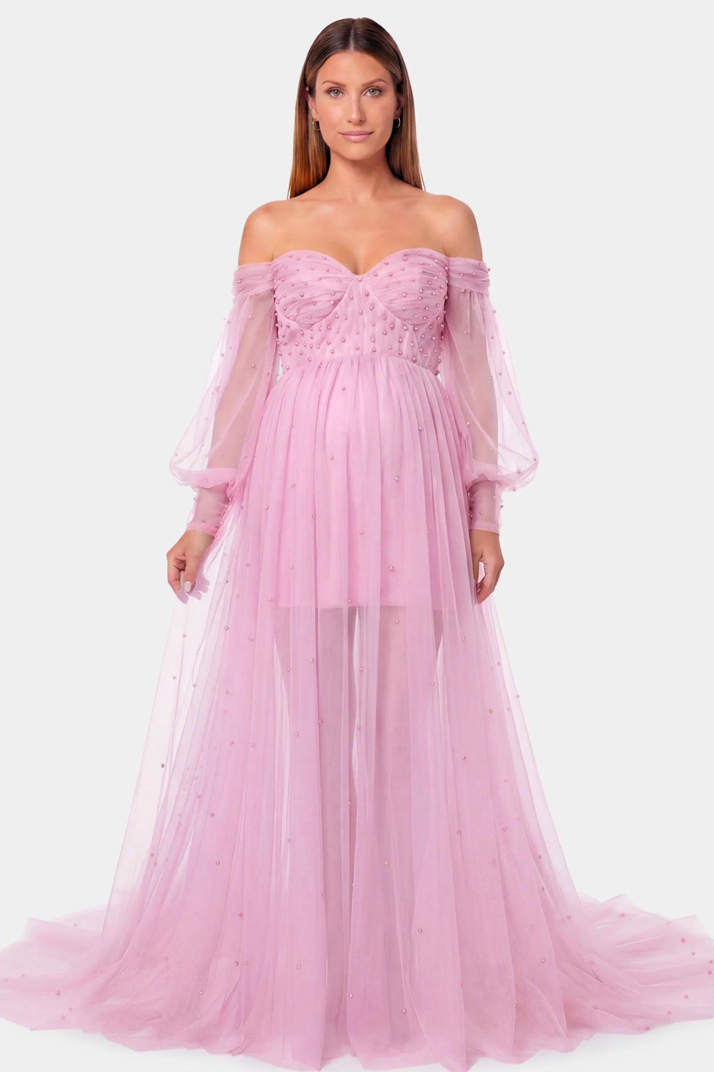 Off-Shoulder Empire Waist Maternity Gown Off-Shoulder Empire Waist Maternity Gown in pink featuring a sweetheart neckline and flowy A-line silhouette on a pregnant model.