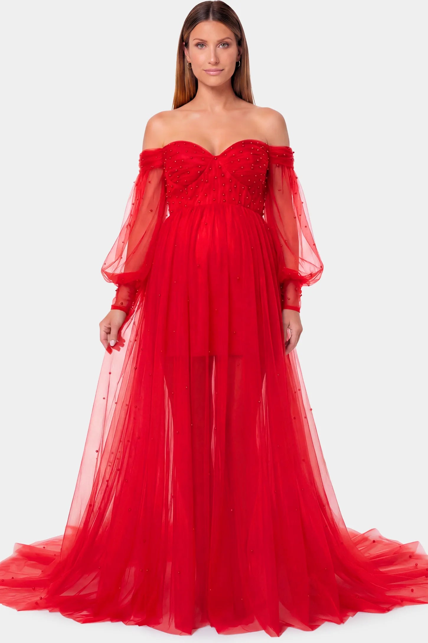 Off-Shoulder Empire Waist Maternity Gown Off-Shoulder Empire Waist Maternity Gown in red featuring a sweetheart neckline and flowy A-line silhouette on a pregnant model.