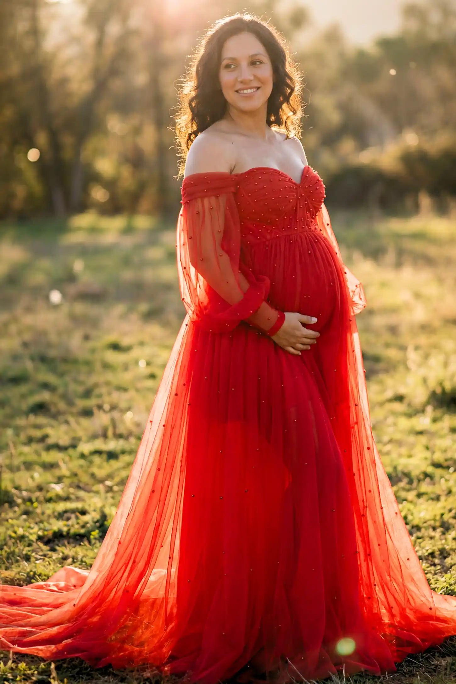 Off-Shoulder Empire Waist Maternity Gown Off-Shoulder Empire Waist Maternity Gown in red featuring a sweetheart neckline and flowy A-line silhouette on a pregnant model.