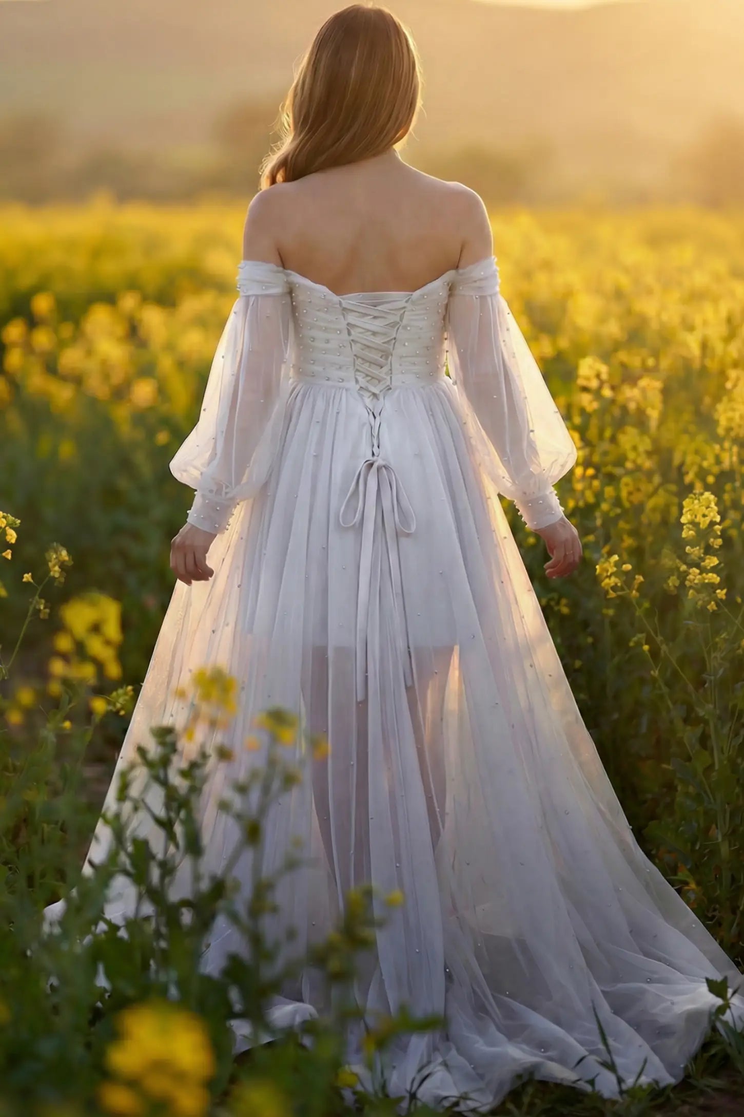 Off-Shoulder Empire Waist Maternity Gown Off-Shoulder Empire Waist Maternity Gown in white featuring a sweetheart neckline and flowy A-line silhouette on a pregnant model, back view.