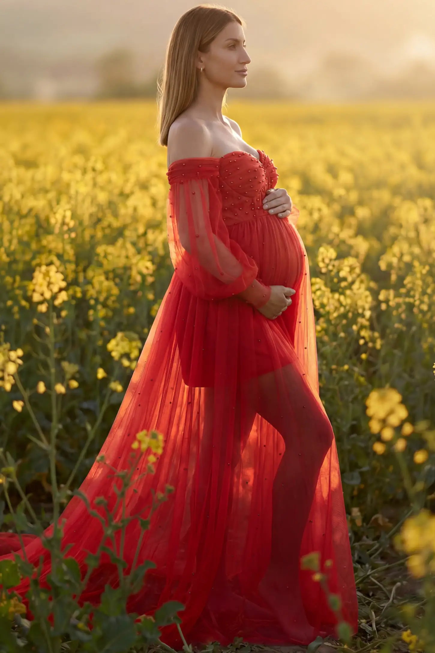 Off-Shoulder Empire Waist Maternity Gown Off-Shoulder Empire Waist Maternity Gown in red featuring a sweetheart neckline and flowy A-line silhouette on a pregnant model, side view.