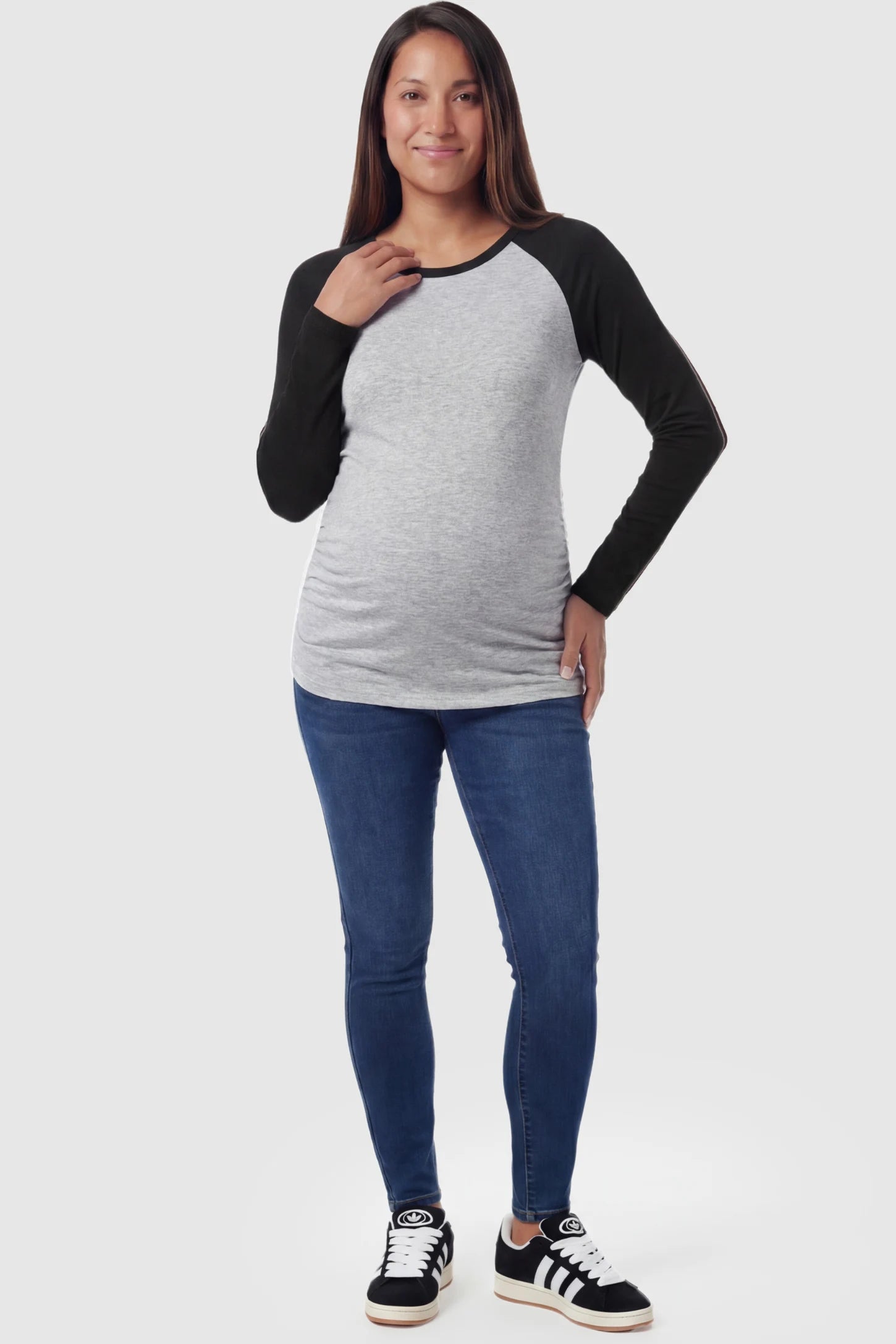 Ruched Raglan Sleeve Maternity Top Ruched Raglan Sleeve Maternity Top in black featuring a round neckline and gentle ruching on a pregnant model.