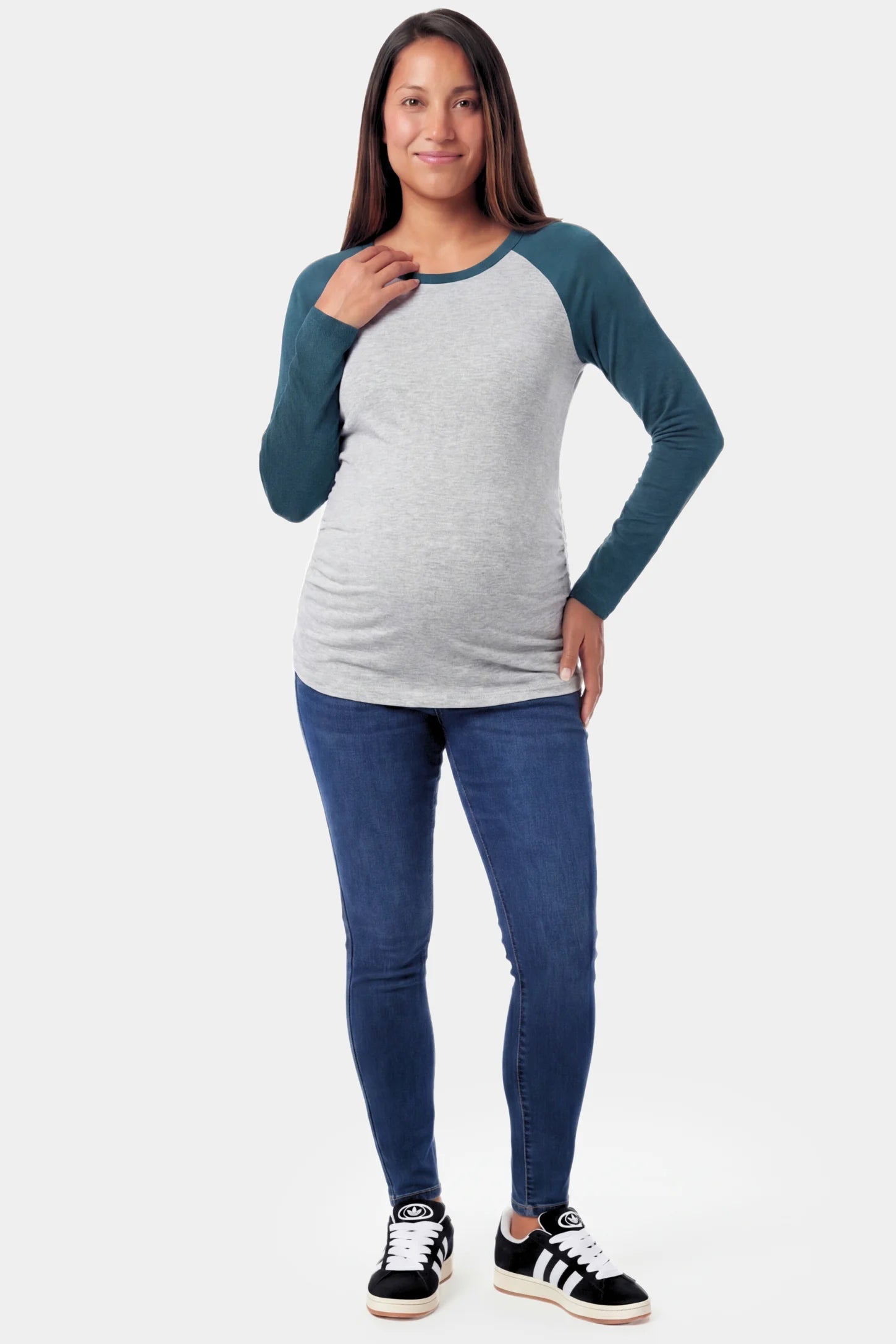 Ruched Raglan Sleeve Maternity Top Ruched Raglan Sleeve Maternity Top in dark blue featuring a round neckline and gentle ruching on a pregnant model.