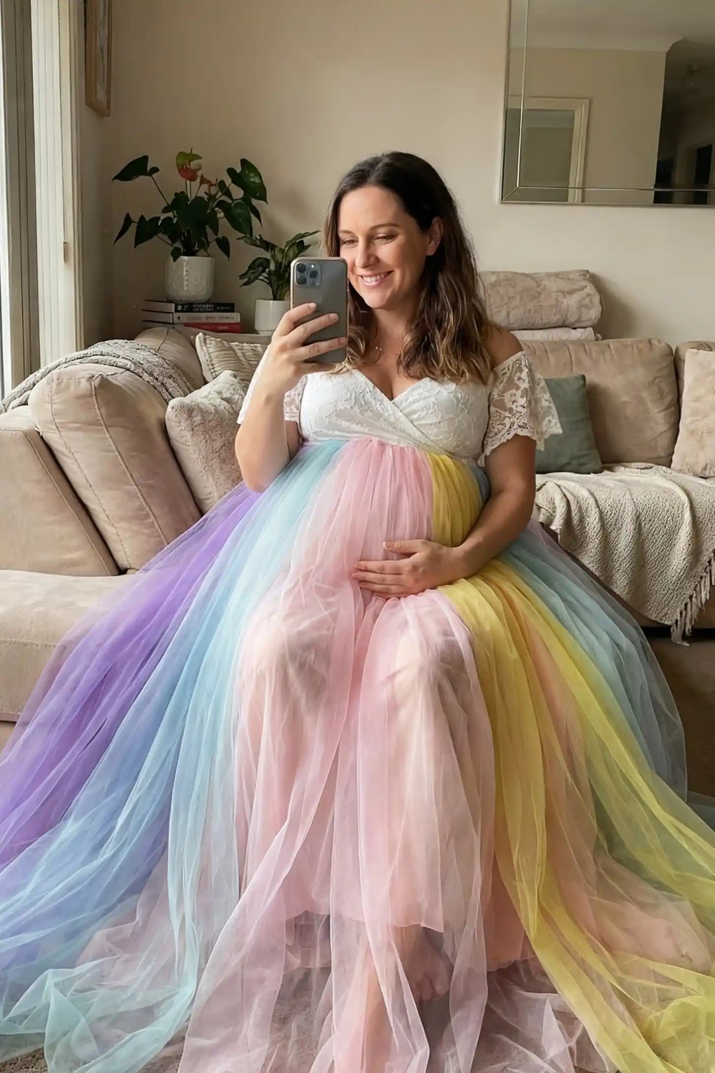 Off-Shoulder Rainbow Tulle Maternity Photoshoot Dress Off-Shoulder Rainbow Tulle Maternity Photoshoot Dress in White featuring a lace bodice on a pregnant model.