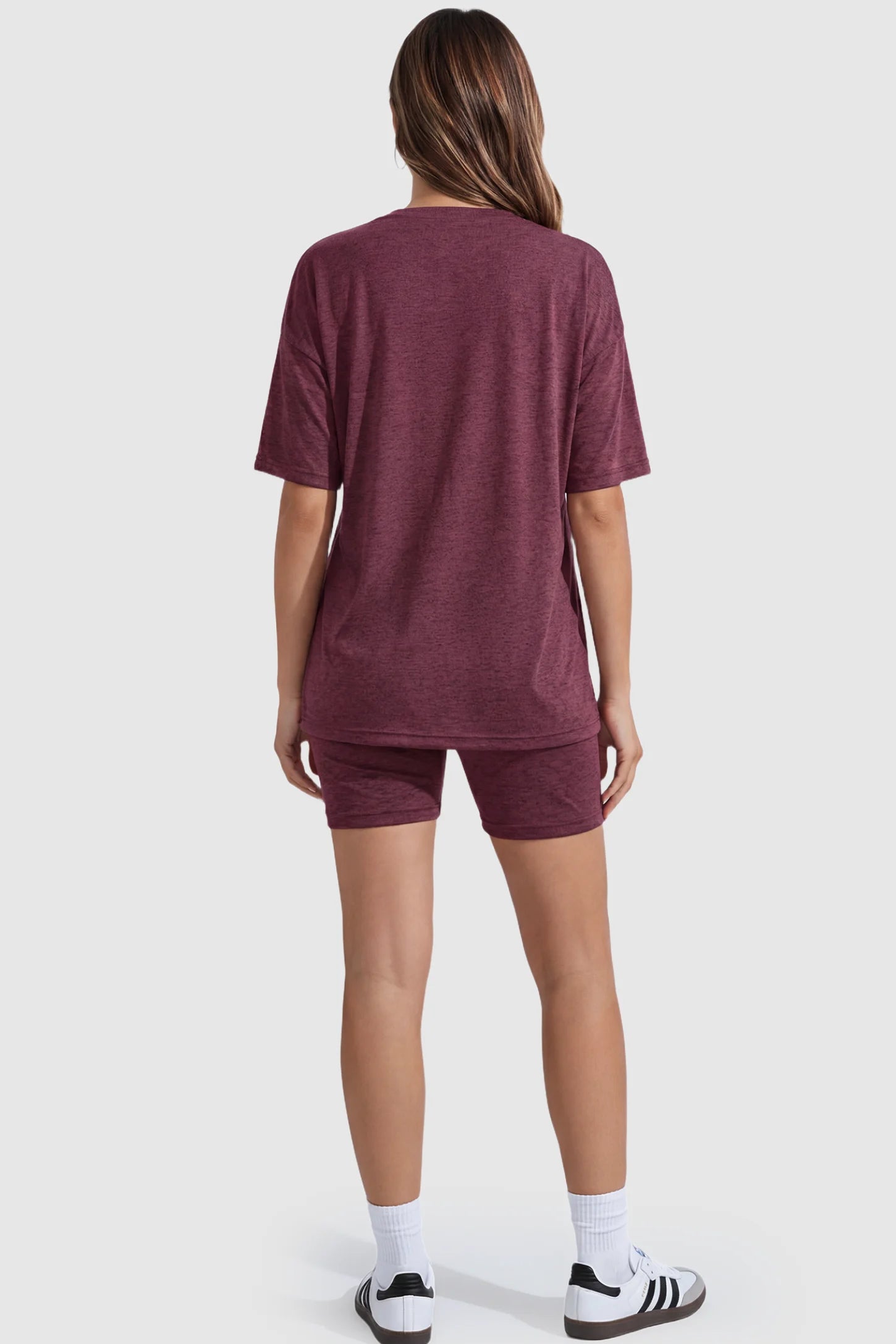 Stretch Oversized Tee & Biker Short Maternity Lounge Set Stretch Oversized Tee & Biker Short Maternity Lounge Set in burgundy featuring relaxed-fit T-shirt and mid-thigh fitted biker shorts on pregnant model.