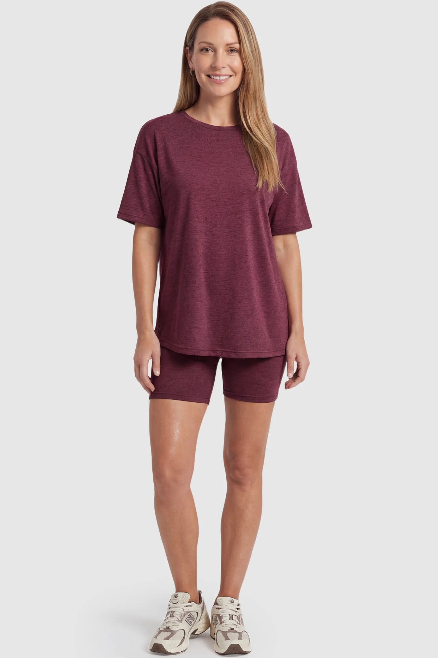 Stretch Oversized Tee & Biker Short Maternity Lounge Set Stretch Oversized Tee & Biker Short Maternity Lounge Set in burgundy featuring relaxed-fit T-shirt and mid-thigh fitted biker shorts on a non pregnant model.