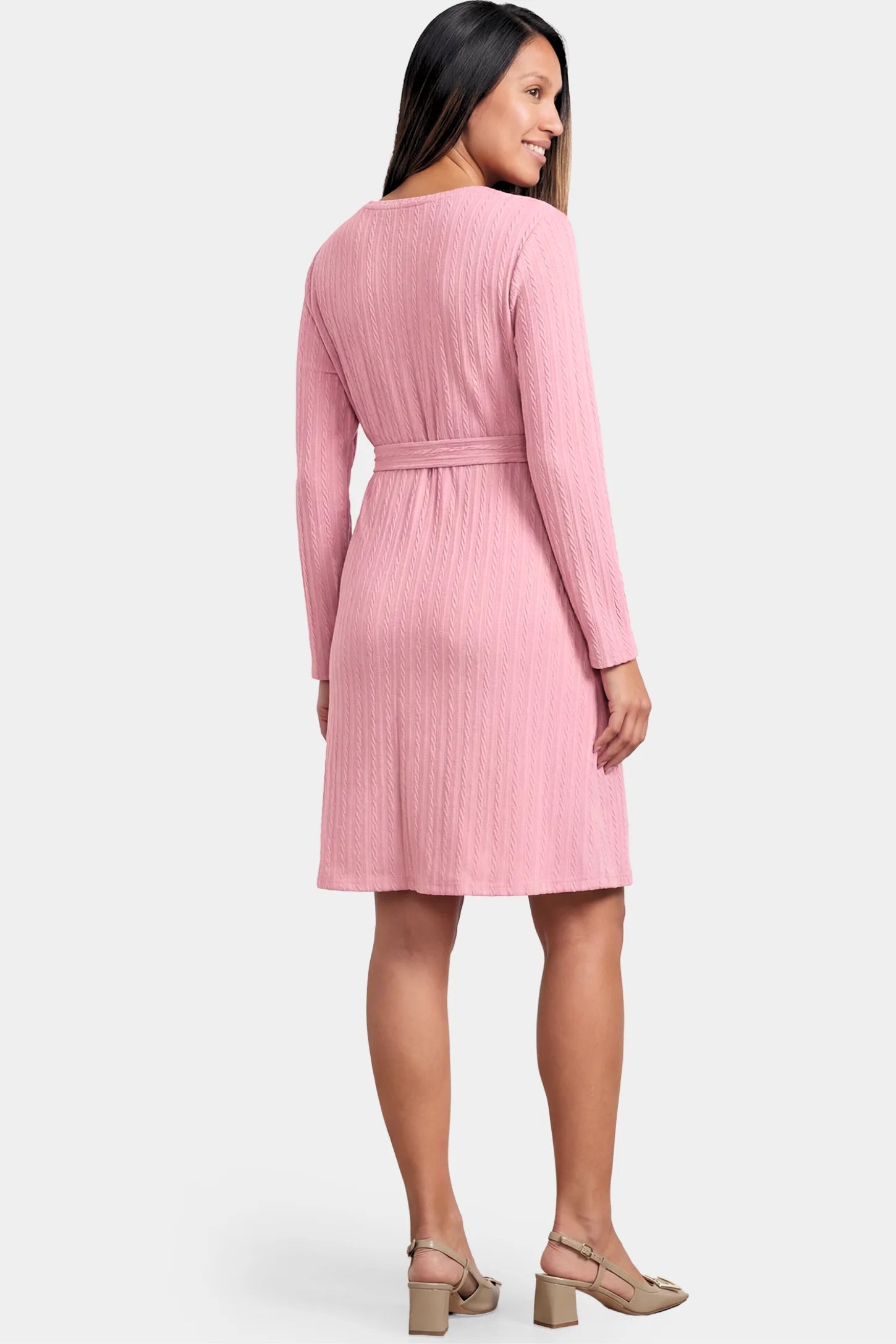Ribbed Knit Long Sleeve Maternity Short Dress Ribbed Knit Long Sleeve Maternity Short Dress in pink featuring a ribbed texture and adjustable tie waist on a pregnant model.