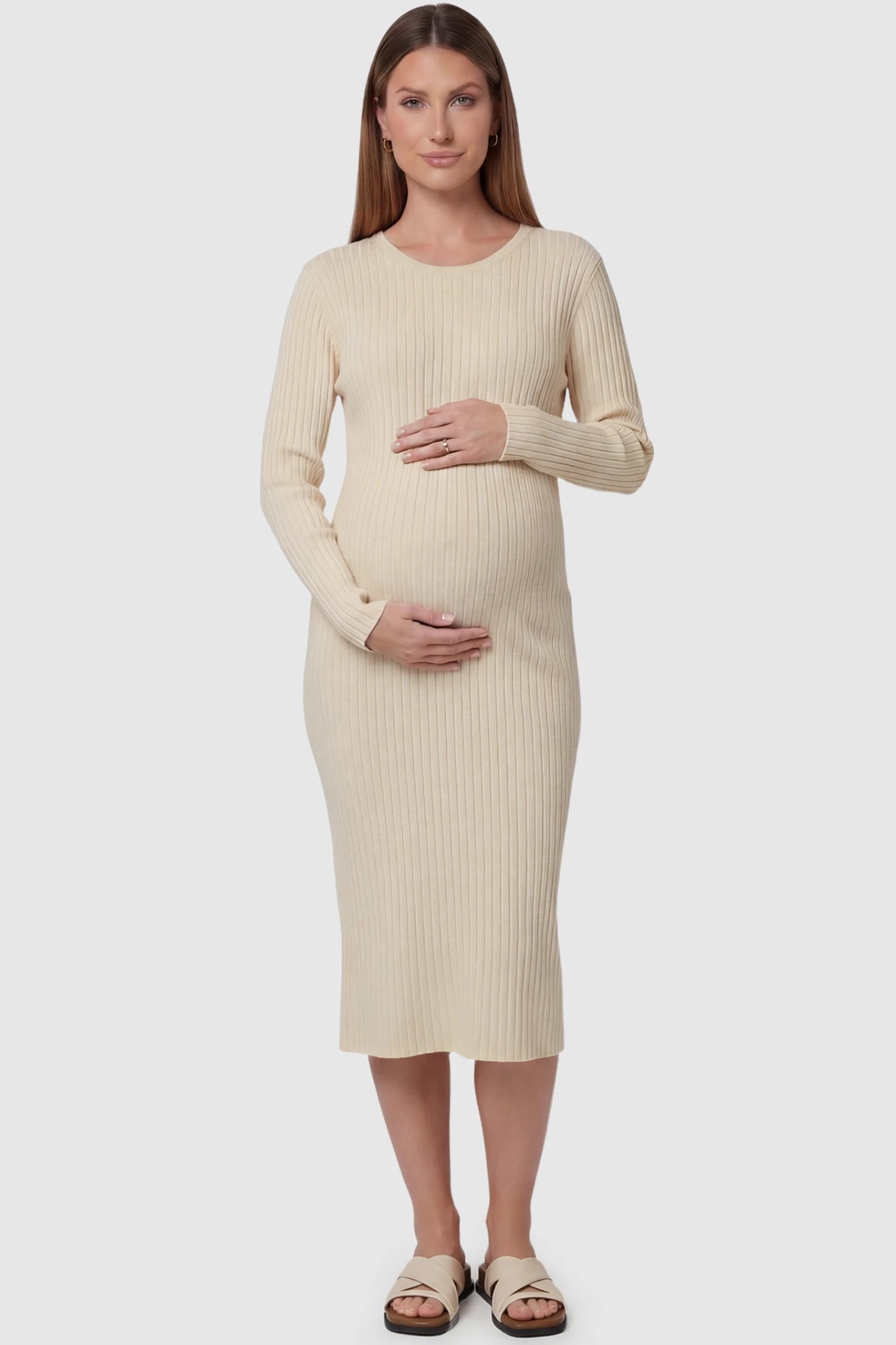 Ribbed Knit Long Sleeve Maternity Midi Dress Ribbed knit long sleeve maternity midi dress in apricot with smooth stretch ribbed knit fabric, front view on pregnant model
