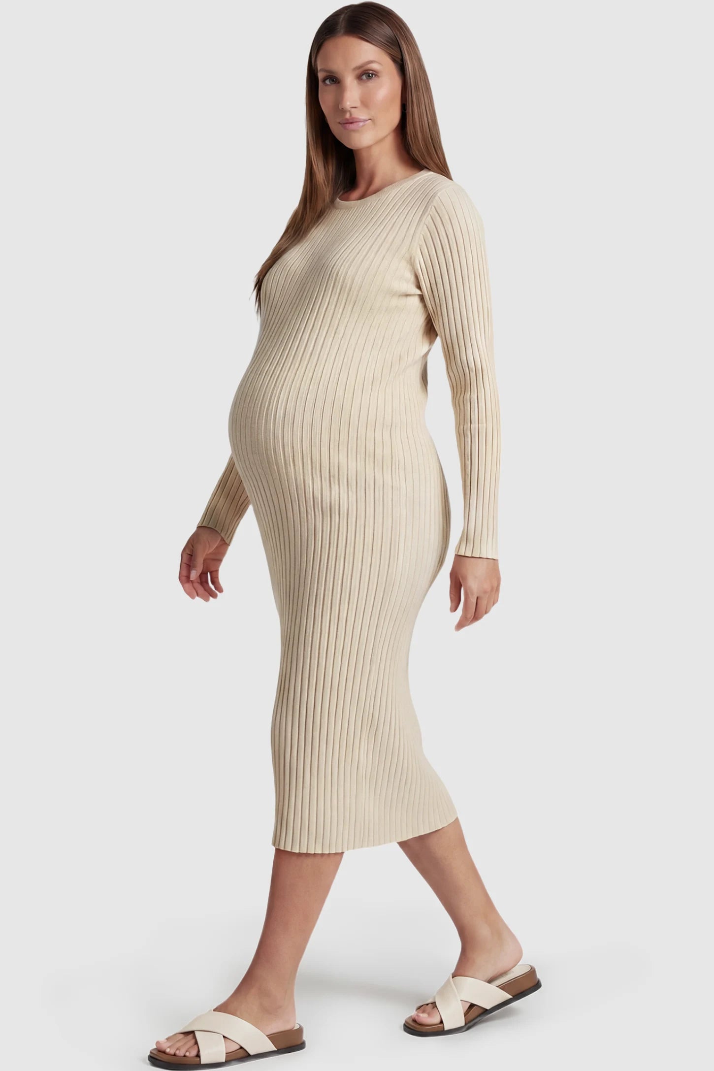 Ribbed Knit Long Sleeve Maternity Midi Dress Ribbed knit long sleeve maternity midi dress in apricot with smooth stretch ribbed knit fabric, side view on pregnant model
