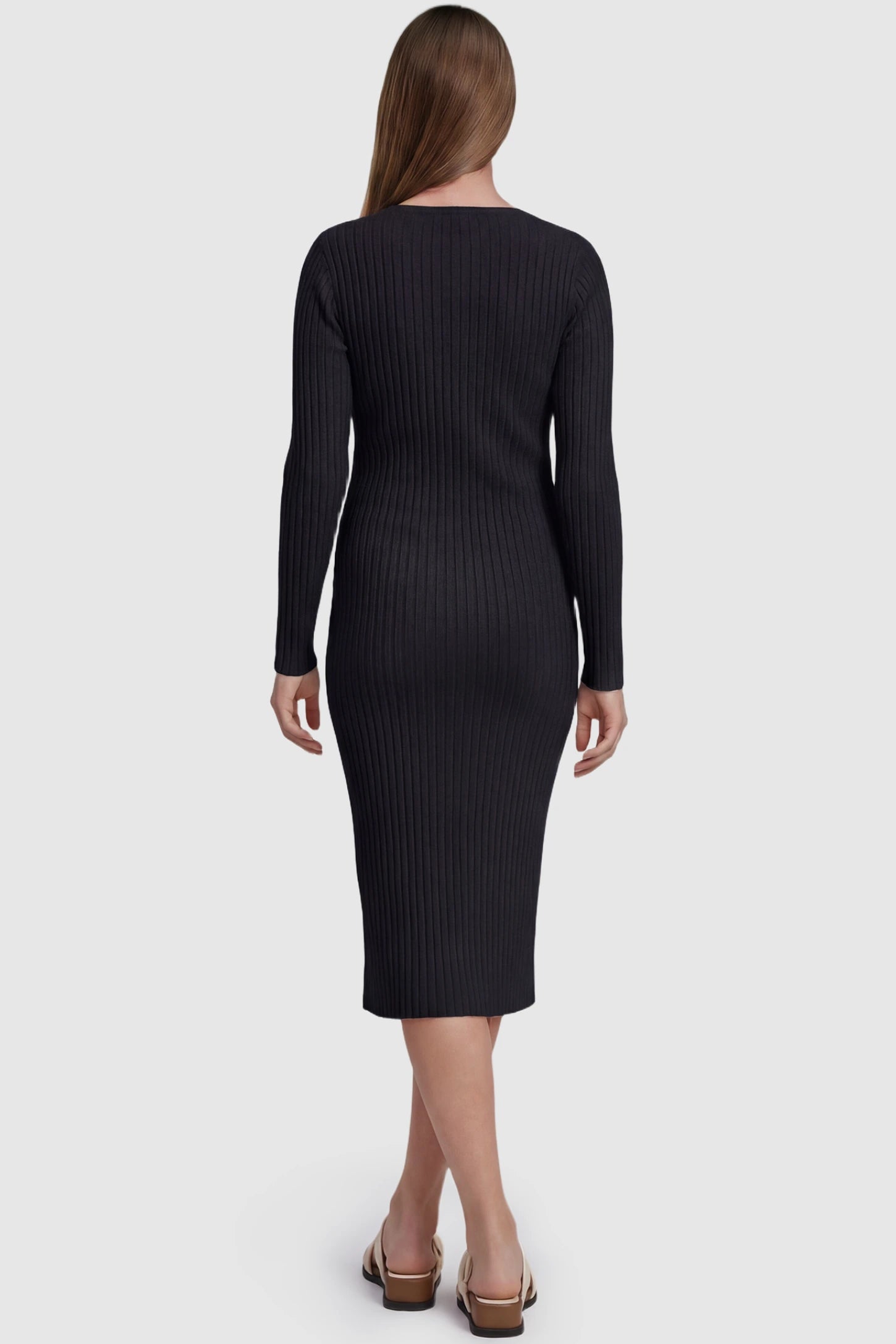 Ribbed Knit Long Sleeve Maternity Midi Dress Ribbed knit long sleeve maternity midi dress in black with smooth stretch ribbed knit fabric, back view on pregnant model