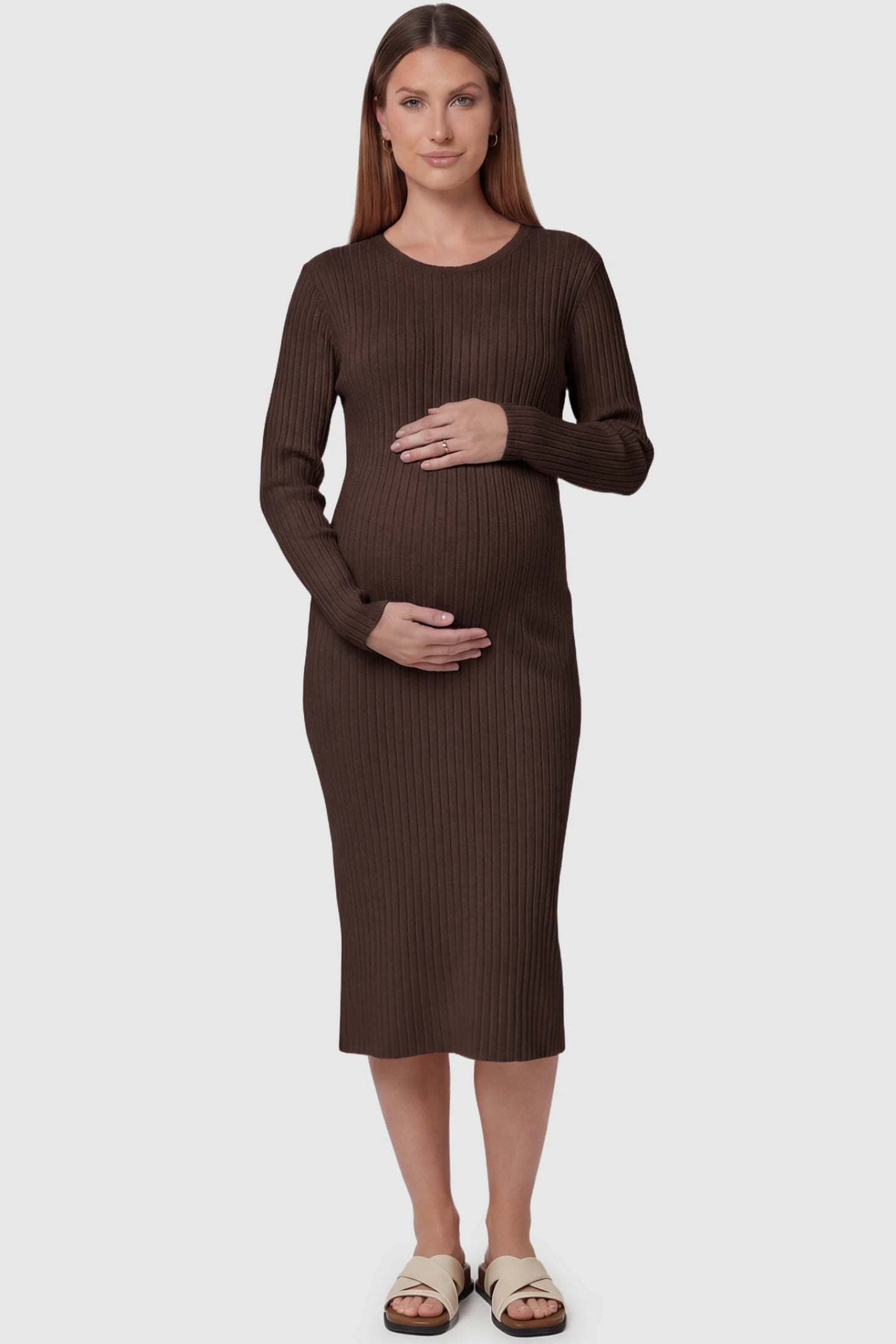 Ribbed Knit Long Sleeve Maternity Midi Dress Ribbed knit long sleeve maternity midi dress in brown with smooth stretch ribbed knit fabric, front view on pregnant model