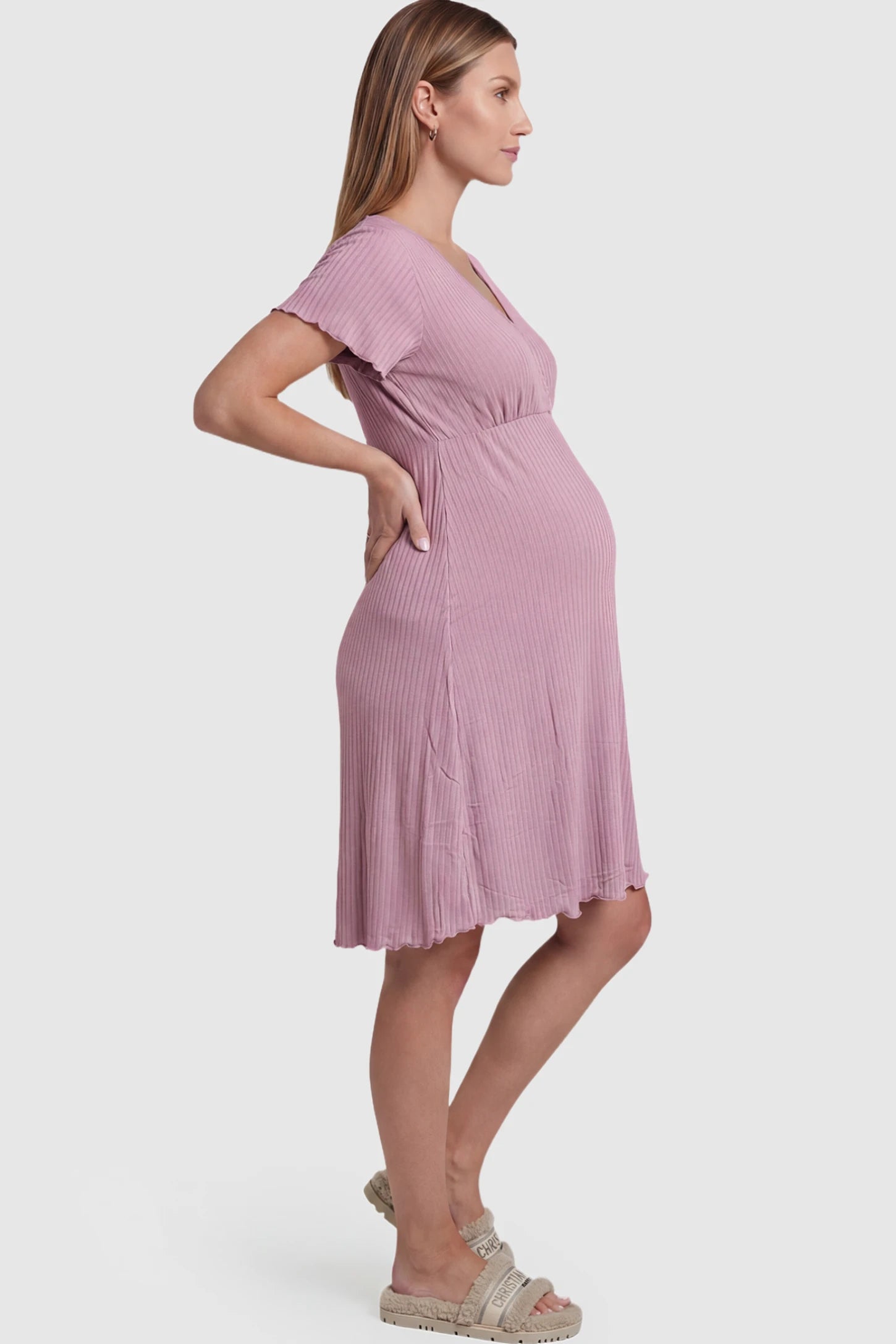 Wrap Style Ribbed Maternity & Nursing Midi Lounge Dress in Dusty Pink featuring wrap-style front for easy nursing access on pregnant model showing side.