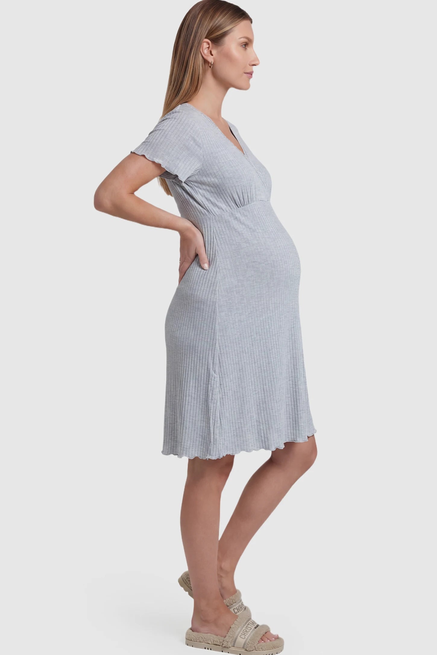 Wrap Style Ribbed Maternity & Nursing Sleepwear Wrap Style Ribbed Maternity & Nursing Midi Lounge Dress in gray featuring wrap-style front for easy nursing access on pregnant model showing side.