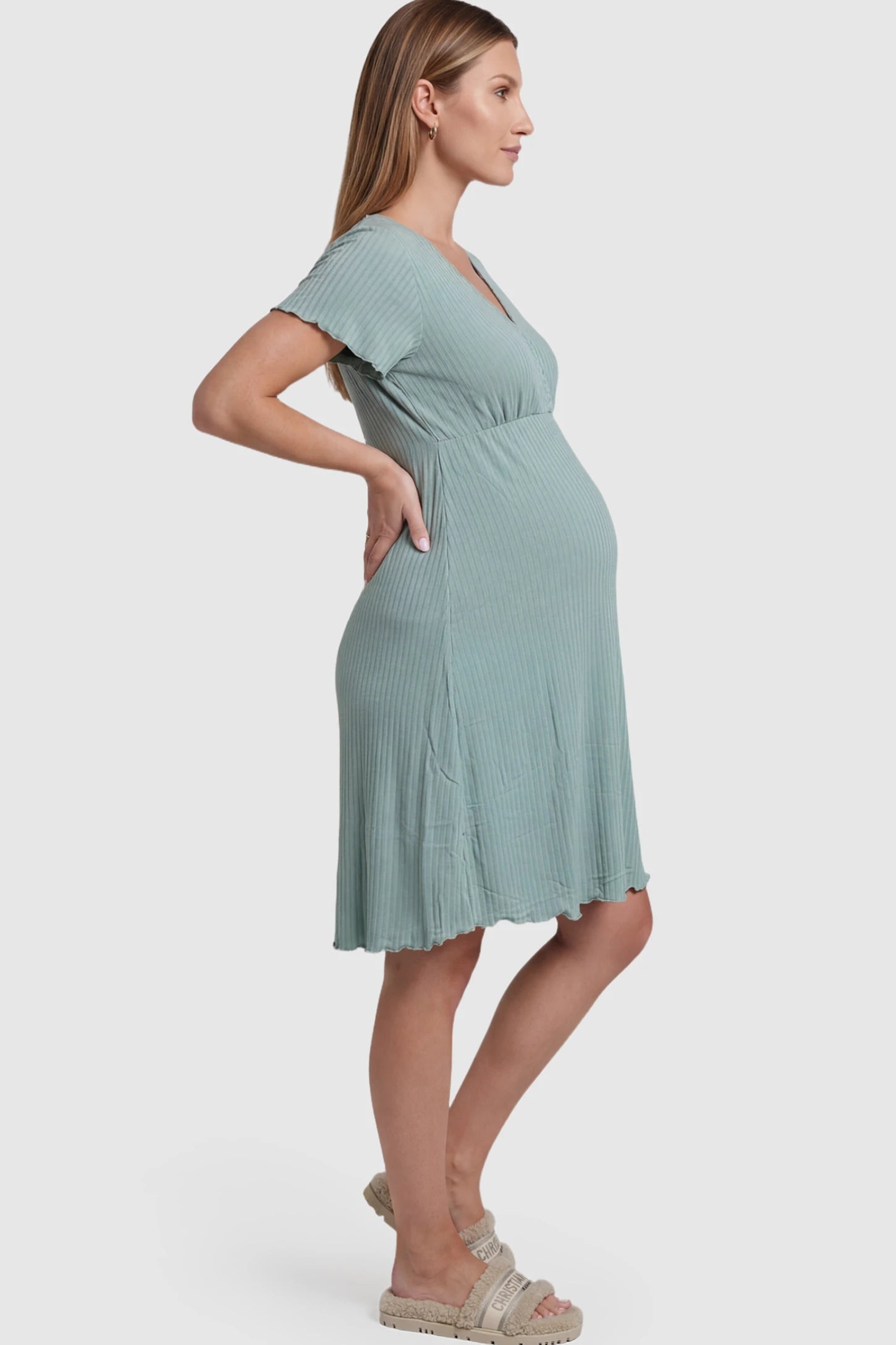 Wrap Style Ribbed Maternity & Nursing Sleepwear Wrap Style Ribbed Maternity & Nursing Midi Lounge Dress in teal featuring wrap-style front for easy nursing access on pregnant model showing side.