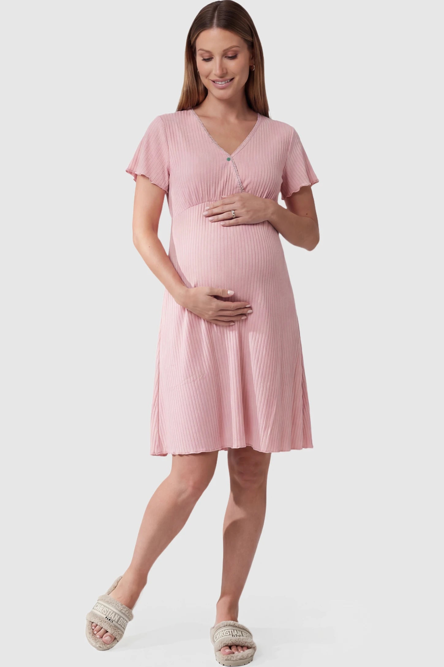 Wrap Style Ribbed Maternity & Nursing Sleepwear Wrap Style Ribbed Maternity & Nursing Midi Lounge Dress in pink featuring wrap-style front for easy nursing access on pregnant model showing front.