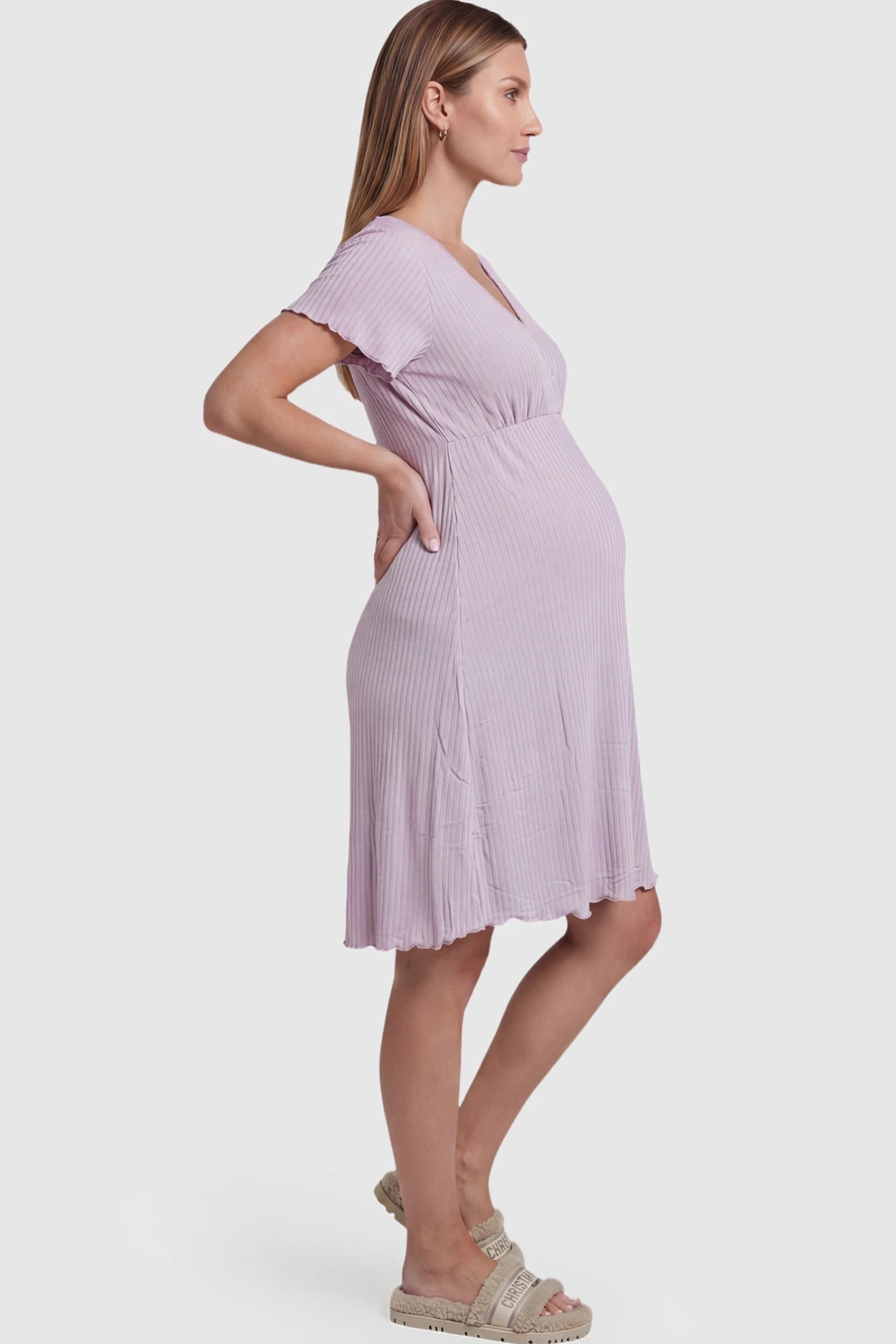 Wrap Style Ribbed Maternity & Nursing Sleepwear Wrap Style Ribbed Maternity & Nursing Midi Lounge Dress in purple featuring wrap-style front for easy nursing access on pregnant model showing side.