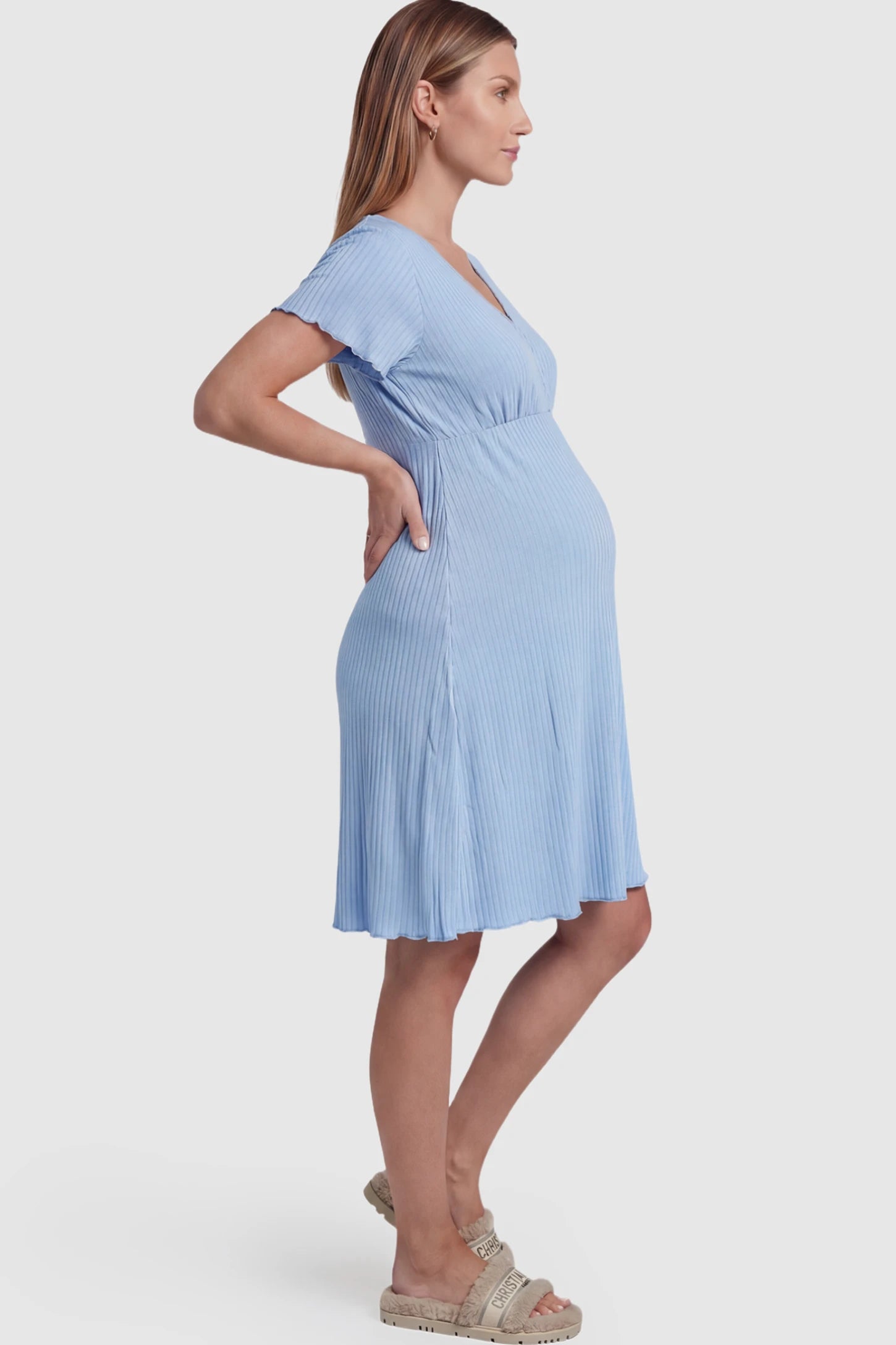 Wrap Style Ribbed Maternity & Nursing Sleepwear Wrap Style Ribbed Maternity & Nursing Midi Lounge Dress in blue featuring wrap-style front for easy nursing access on pregnant model showing side.