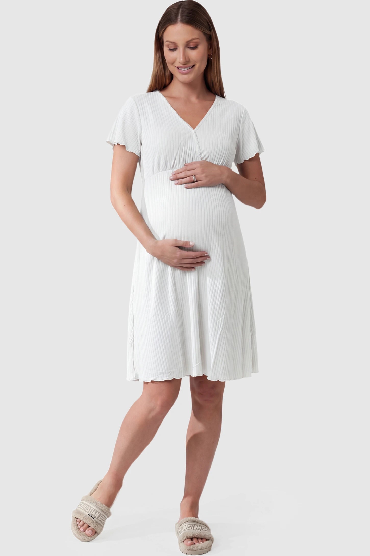 Wrap Style Ribbed Maternity & Nursing Sleepwear Wrap Style Ribbed Maternity & Nursing Midi Lounge Dress in white featuring wrap-style front for easy nursing access on pregnant model showing front.
