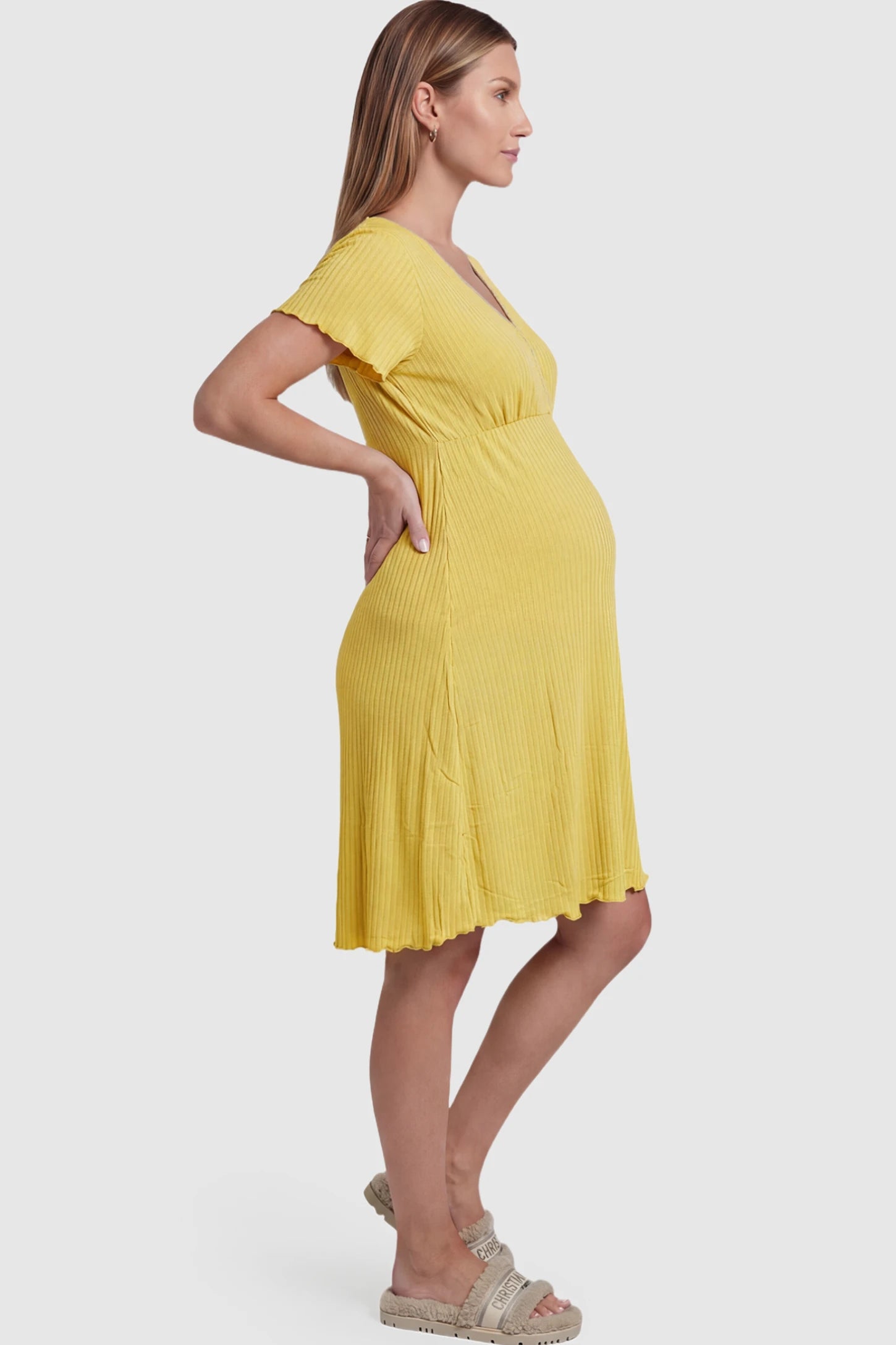 Wrap Style Ribbed Maternity & Nursing Sleepwear Wrap Style Ribbed Maternity & Nursing Midi Lounge Dress in yellow featuring wrap-style front for easy nursing access on pregnant model showing side.