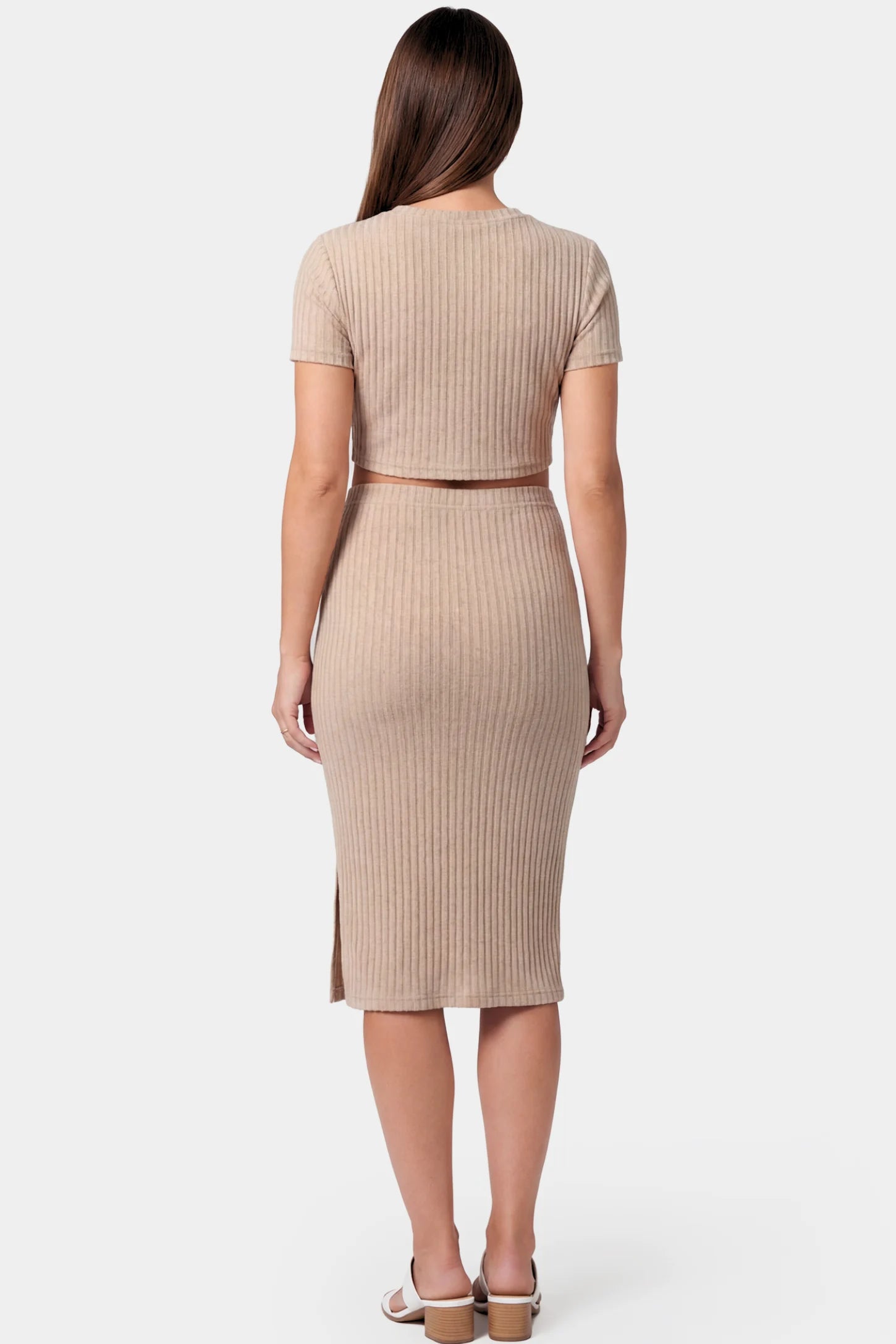 Ribbed Bodycon Crop Top & Skirt Maternity Set Ribbed Bodycon Crop Top & Skirt Maternity Set in beige featuring a fitted ribbed knit silhouette with side slit on a pregnant model.