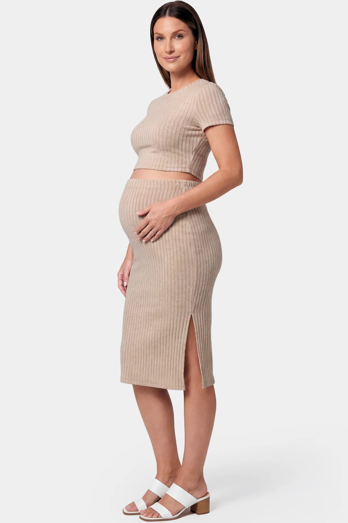 Ribbed Bodycon Crop Top & Skirt Maternity Set in beige featuring a fitted ribbed knit silhouette with side slit on a pregnant model.