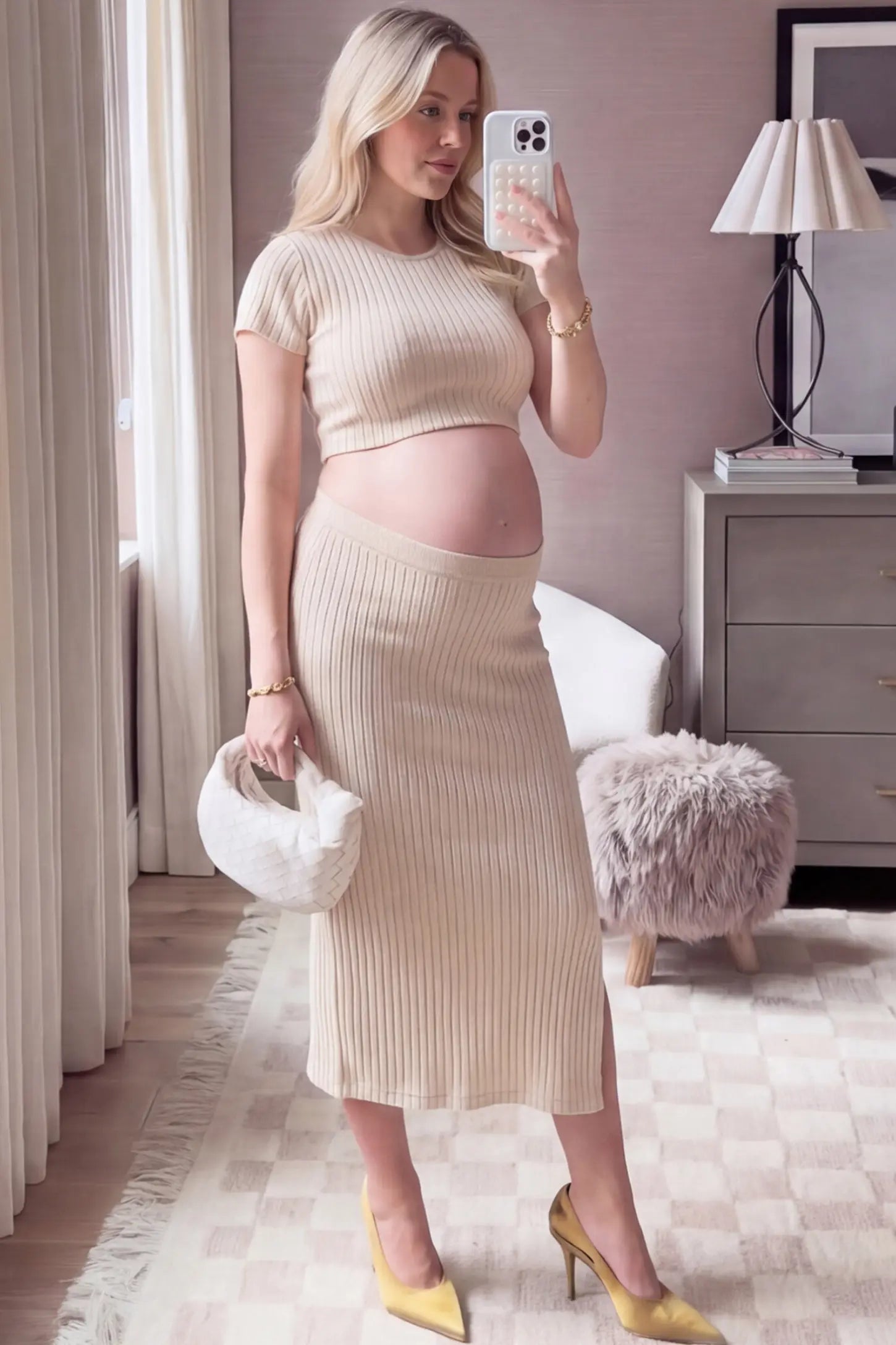 Ribbed Bodycon Crop Top & Skirt Maternity Set Ribbed Bodycon Crop Top & Skirt Maternity Set in beige featuring a fitted ribbed knit silhouette with side slit on a pregnant woman front view.