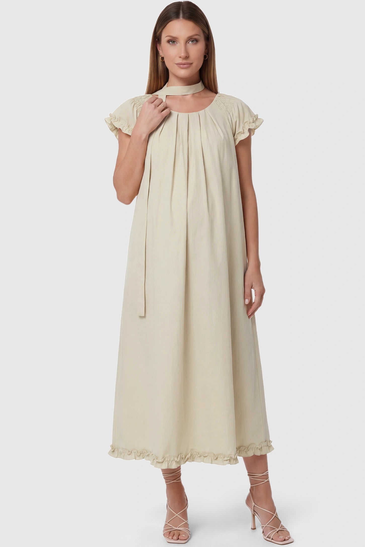 Round Neck Short Sleeve Maternity Midi Dress with Pockets Round neck short sleeve maternity midi dress with pockets in beige with round neckline and tie neck detail, front view on pregnant model