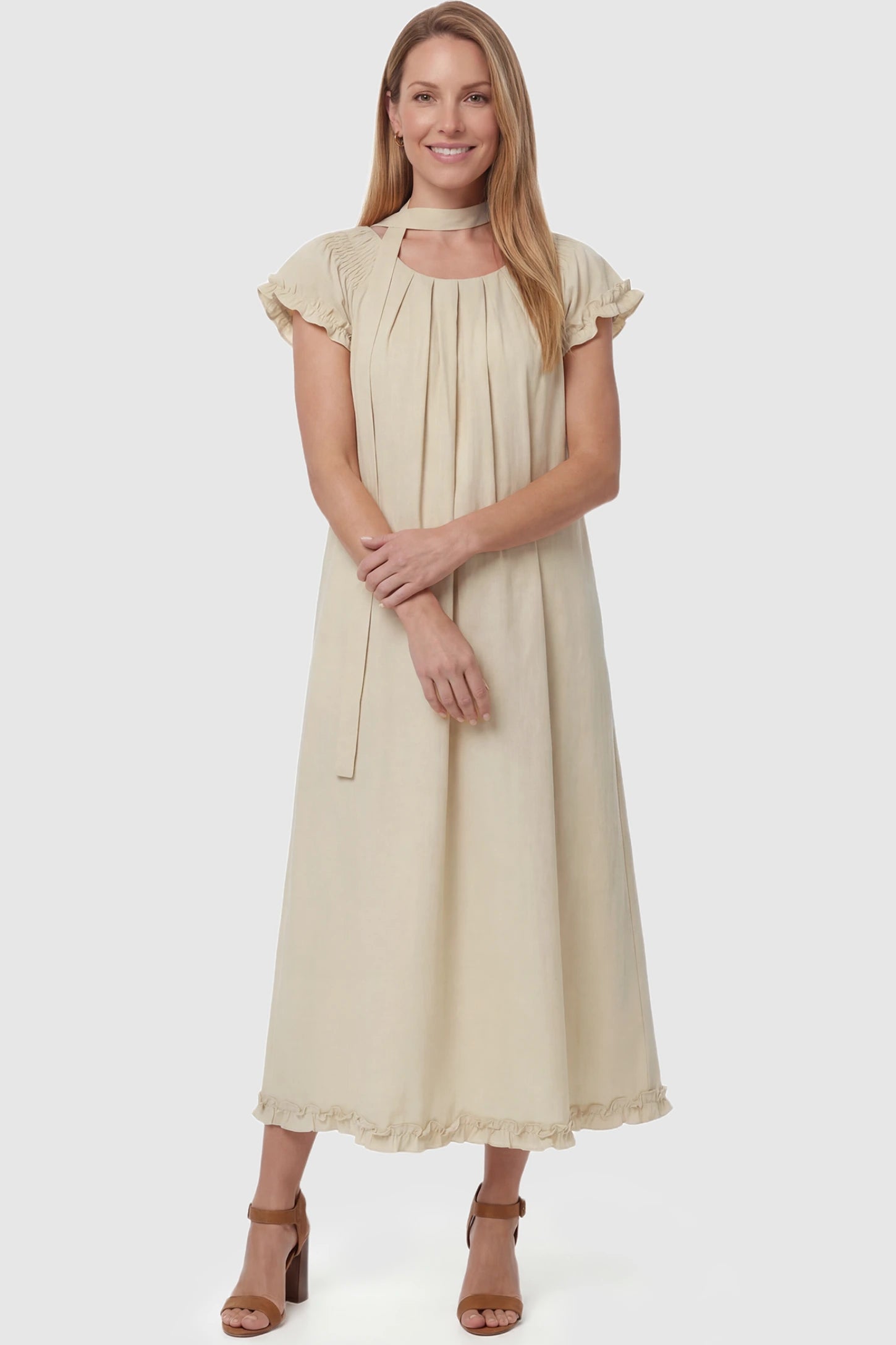 Round Neck Short Sleeve Maternity Midi Dress with Pockets Round neck short sleeve maternity midi dress with pockets in beige with round neckline and tie neck detail, front view on postpartum model