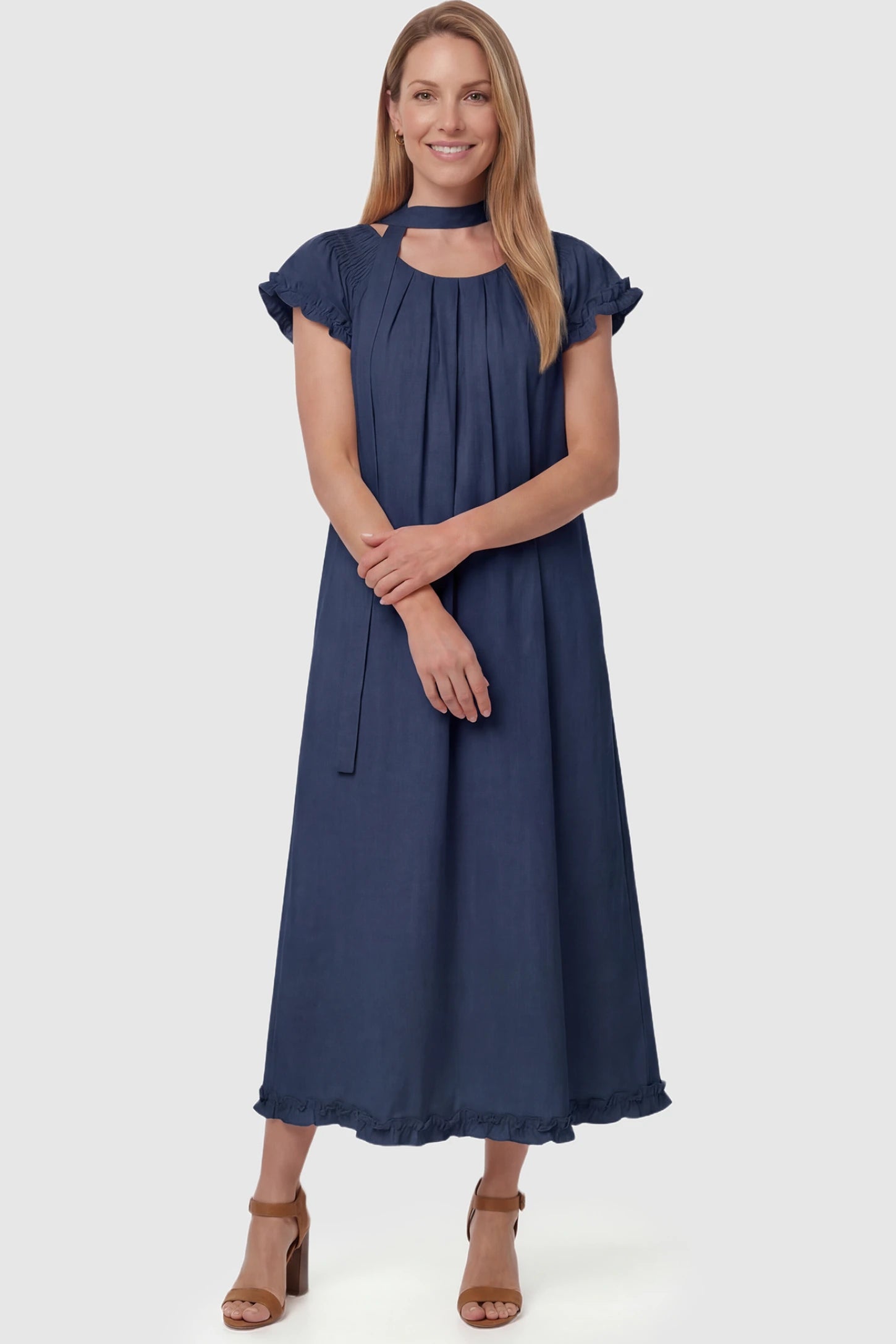 Round Neck Short Sleeve Maternity Midi Dress with Pockets Round neck short sleeve maternity midi dress with pockets in blue with round neckline and tie neck detail, front view on postpartum model