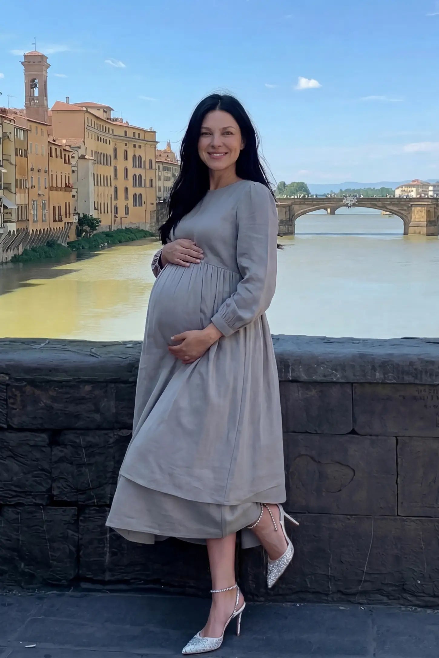 Round neck A-line midi maternity dress in gray featuring long sleeves in front view on a pregnant model