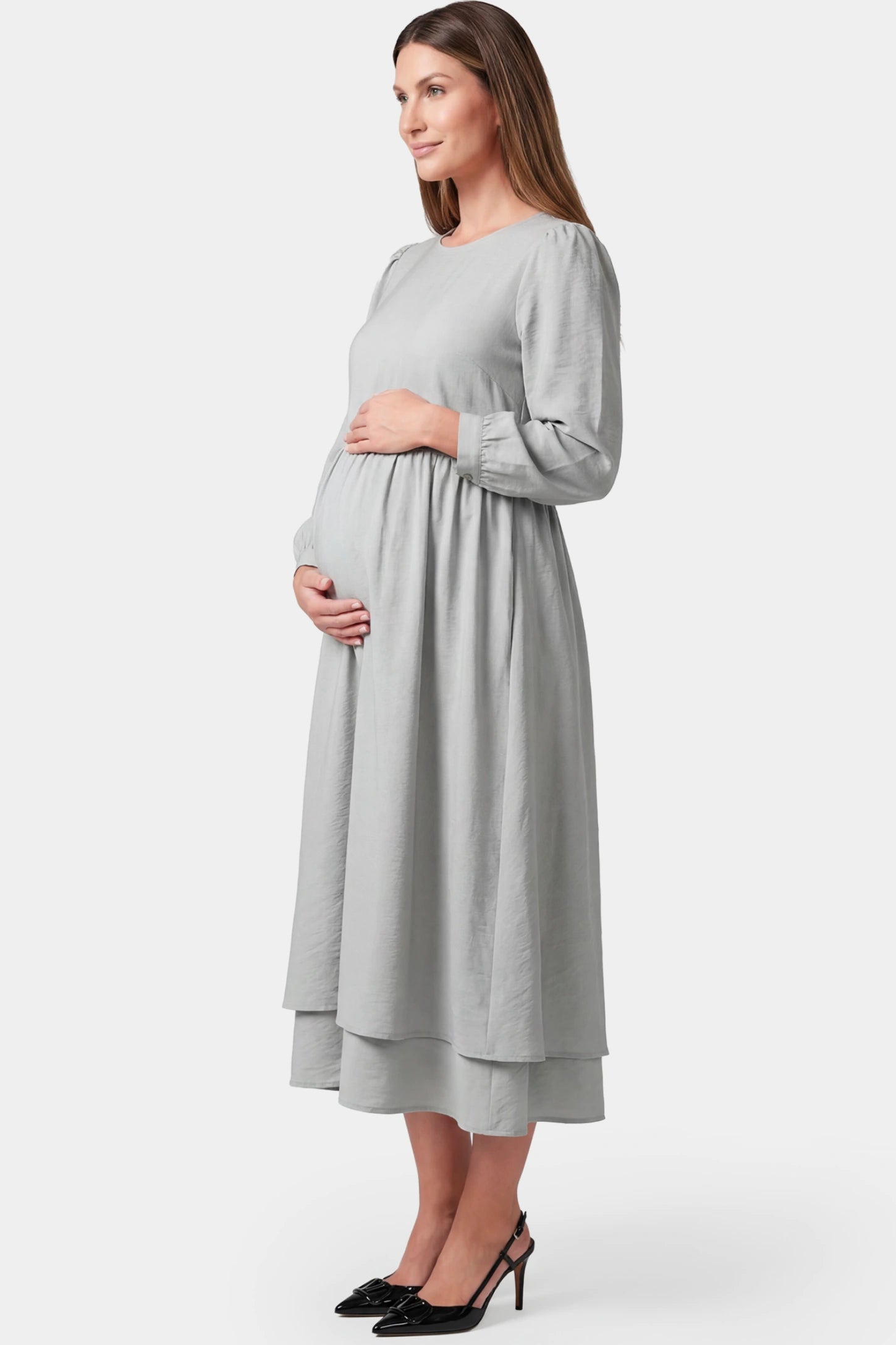 Round neck A-line midi maternity dress in gray featuring loose waist design in side view on a pregnant model