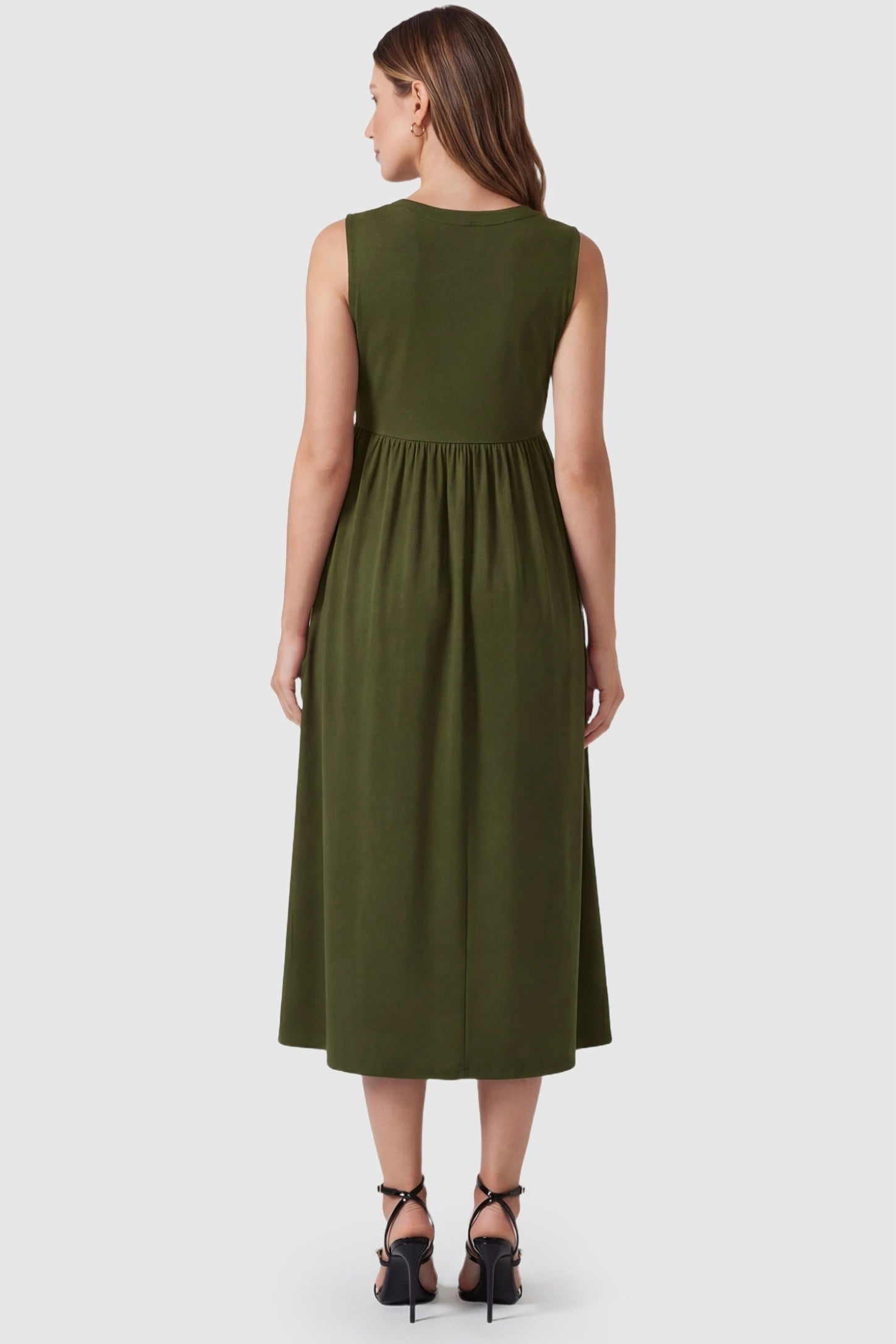 Drawstring Waist Sleeveless Full Skirt Maternity Skater Dress Drawstring Waist Sleeveless Maternity Skater Dress in Army Green featuring a high-back full skirt on a postpartum model.
