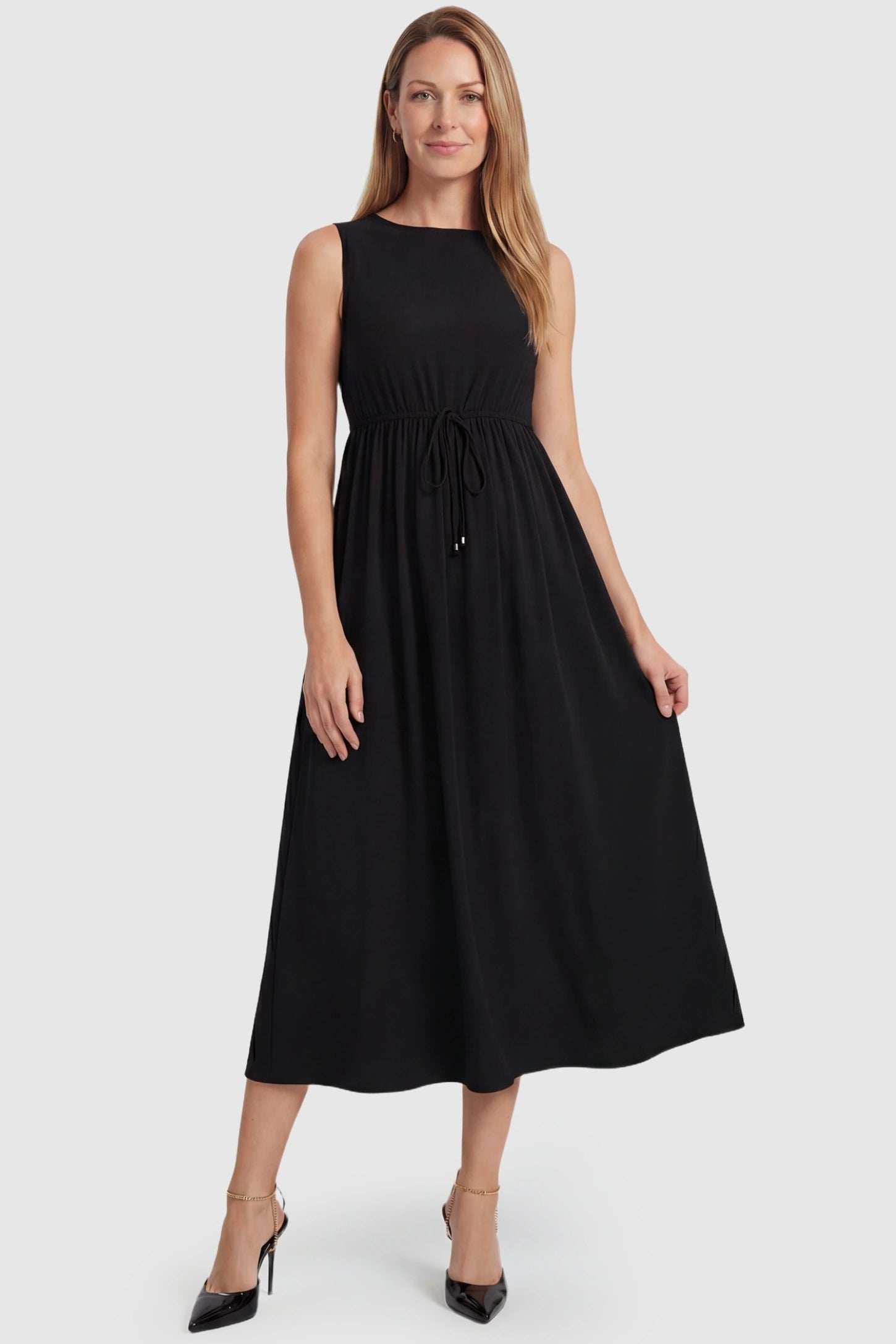 Drawstring Waist Sleeveless Full Skirt Maternity Skater Dress Drawstring Waist Sleeveless Maternity Skater Dress in Black featuring a cinched drawstring on a postpartum model.