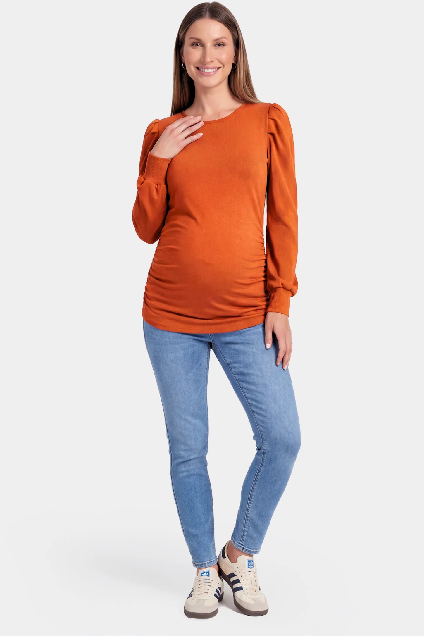 Ribbed Puff Sleeve Maternity Top Ribbed Puff Sleeve Maternity Top in orange featuring a round neckline and gentle ruching on a pregnant model.