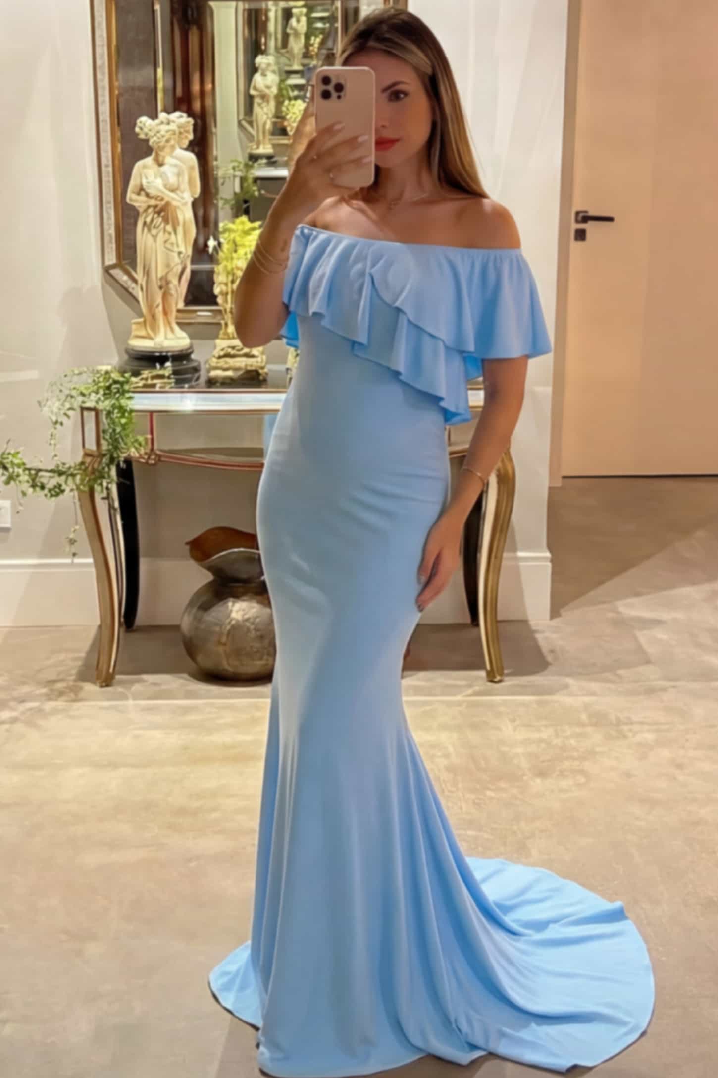 Off-Shoulder Mermaid Maternity Gown Off-Shoulder Mermaid Maternity Gown in light blue featuring ruffle overlay, flounce neckline, and sweep train on pregnant model.