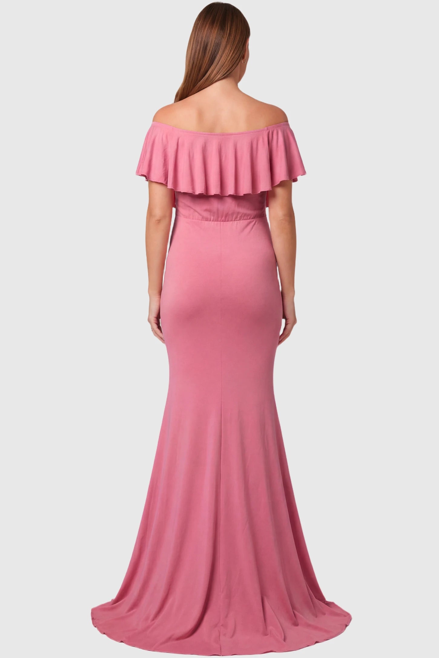 Off-Shoulder Mermaid Maternity Gown Off-Shoulder Mermaid Maternity Gown in pink featuring ruffle overlay, and sweep train on pregnant model.