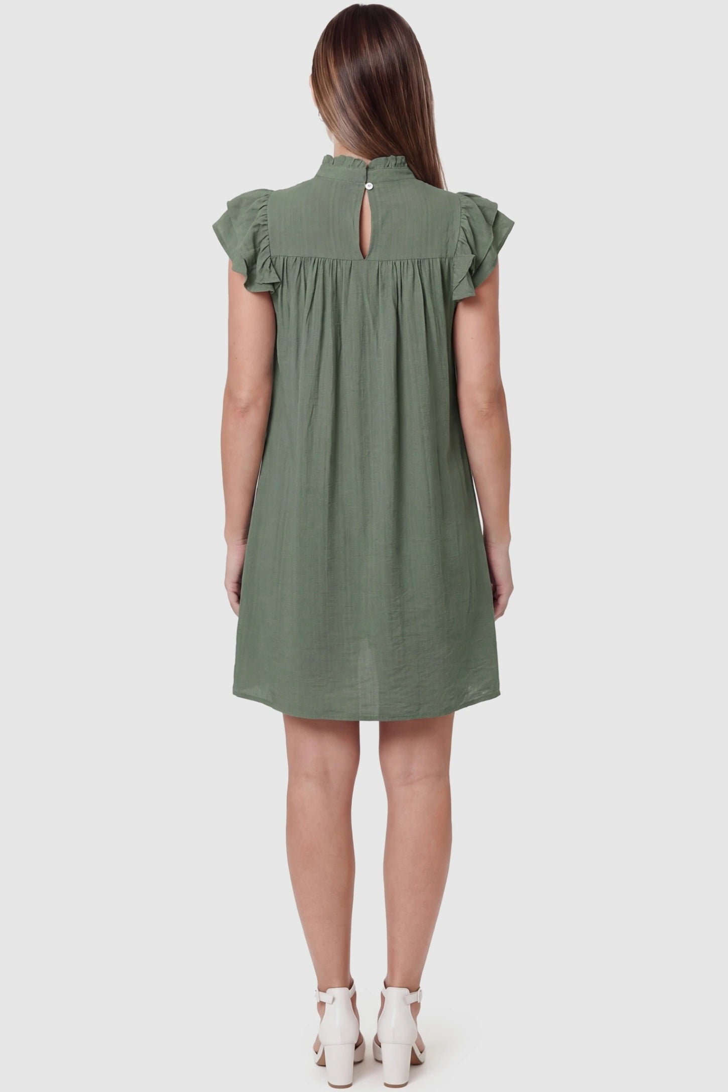 Ruffle Sleeve Pleated A-Line Maternity Mini Dress Ruffle Sleeve Pleated A-Line Maternity Mini Dress in Green featuring a keyhole back and stand-up collar on a pregnant model.