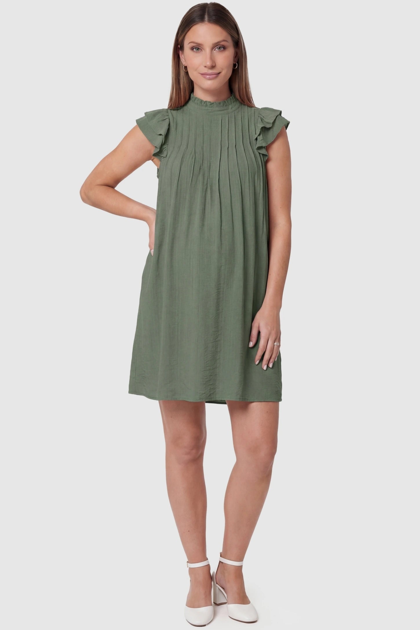 Ruffle Sleeve Pleated A-Line Maternity Mini Dress in Green featuring a high neck and lotus leaf sleeves on a pregnant model.