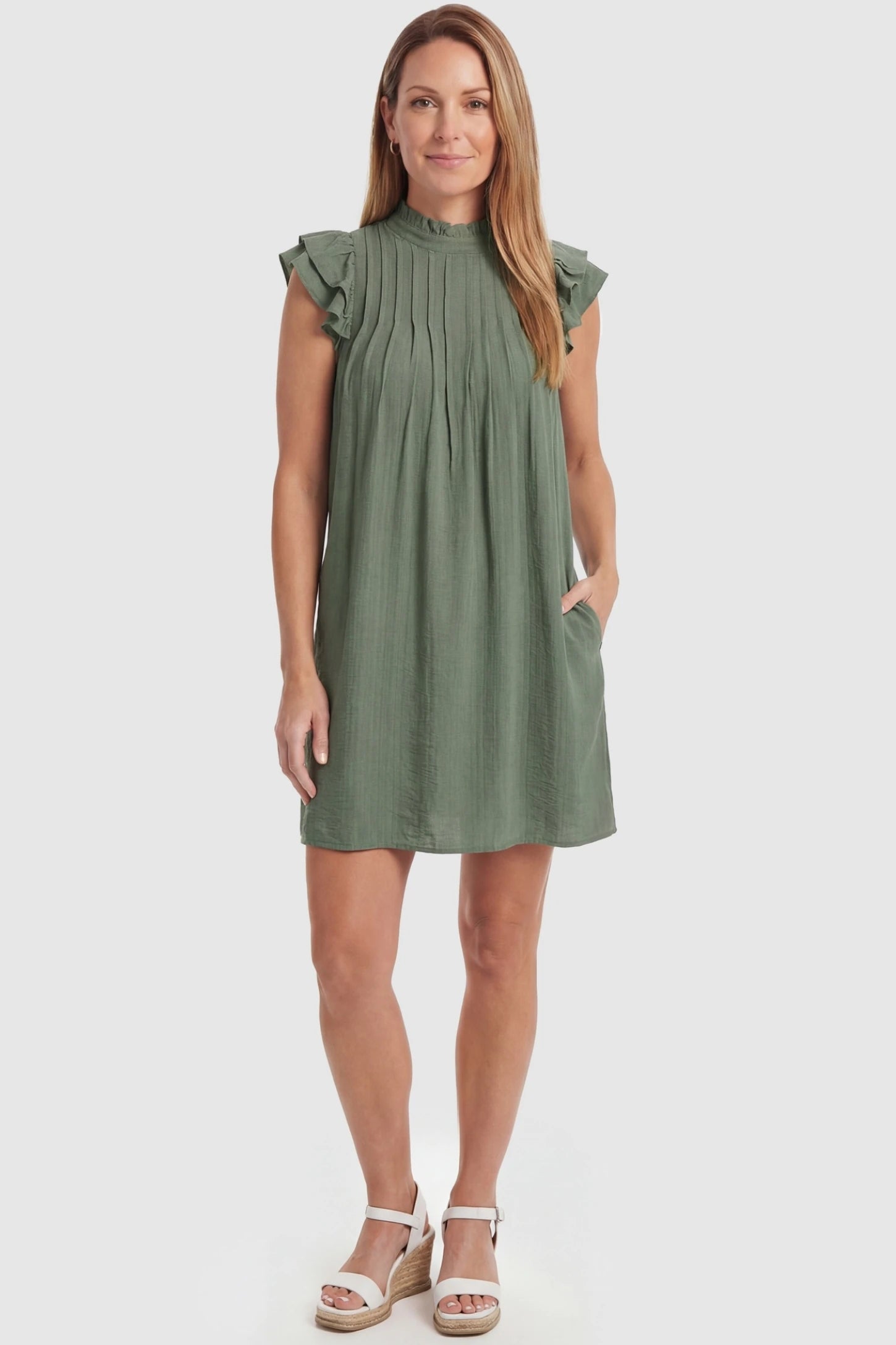Ruffle Sleeve Pleated A-Line Maternity Mini Dress Ruffle Sleeve Pleated A-Line Maternity Mini Dress in Green featuring a flowy shift silhouette and ruffled sleeves on a non-pregnant model.
