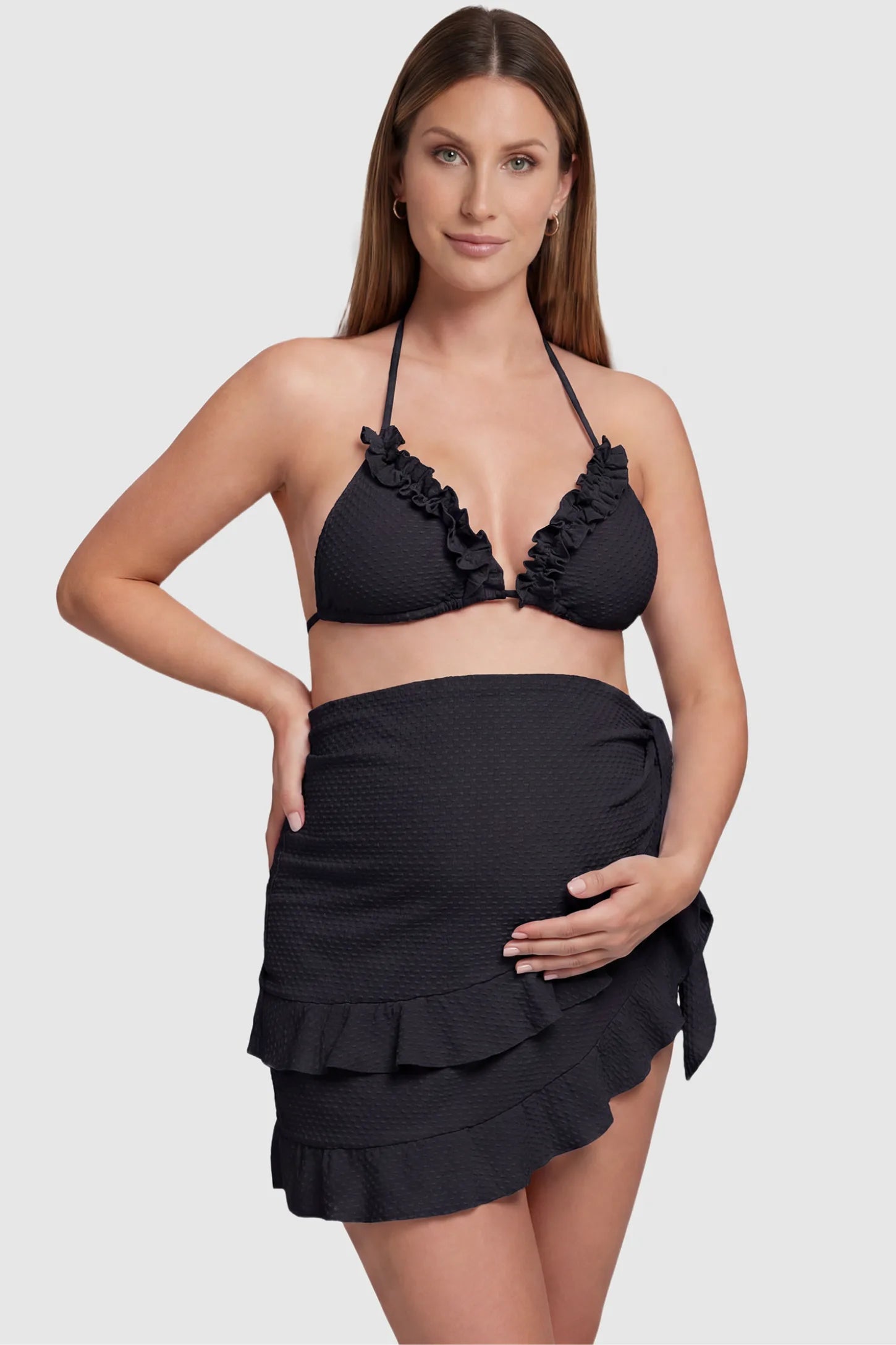 Ruffled Trim Halter Maternity Bikini Set Ruffled trim halter maternity bikini set in black with halter neckline and ruffle detail, front view on pregnant model