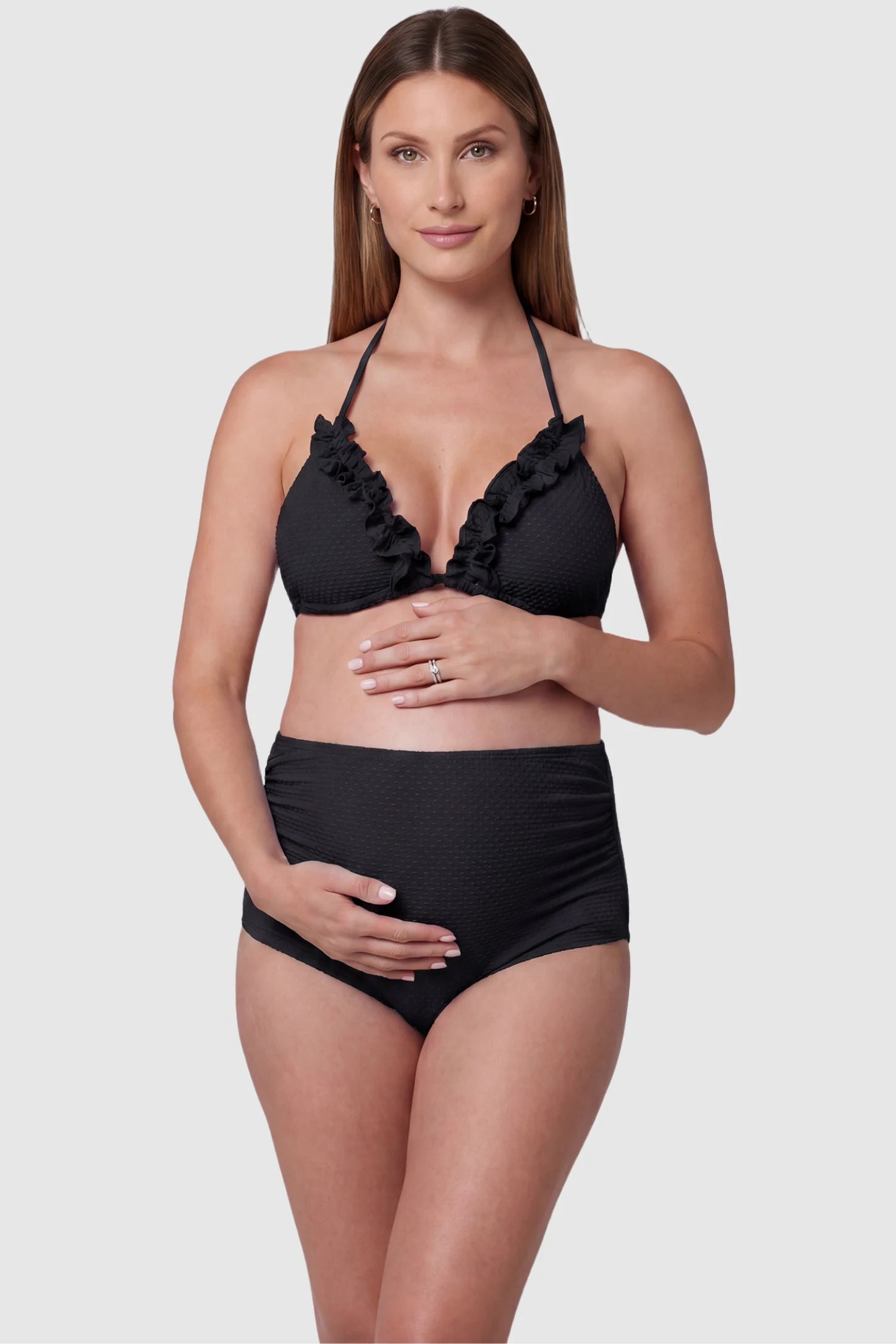 Ruffled Trim Halter Maternity Bikini Set Ruffled trim halter maternity bikini set in black with halter neckline, ruffle detail, and high-waist fit, front view on pregnant model