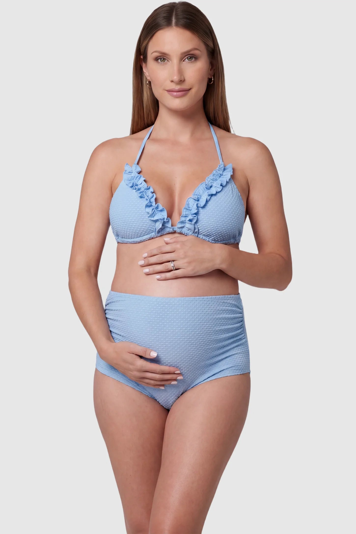 Ruffled Trim Halter Maternity Bikini Set Ruffled trim halter maternity bikini set in blue with halter neckline, ruffle detail, and high-waist fit, front view on pregnant model