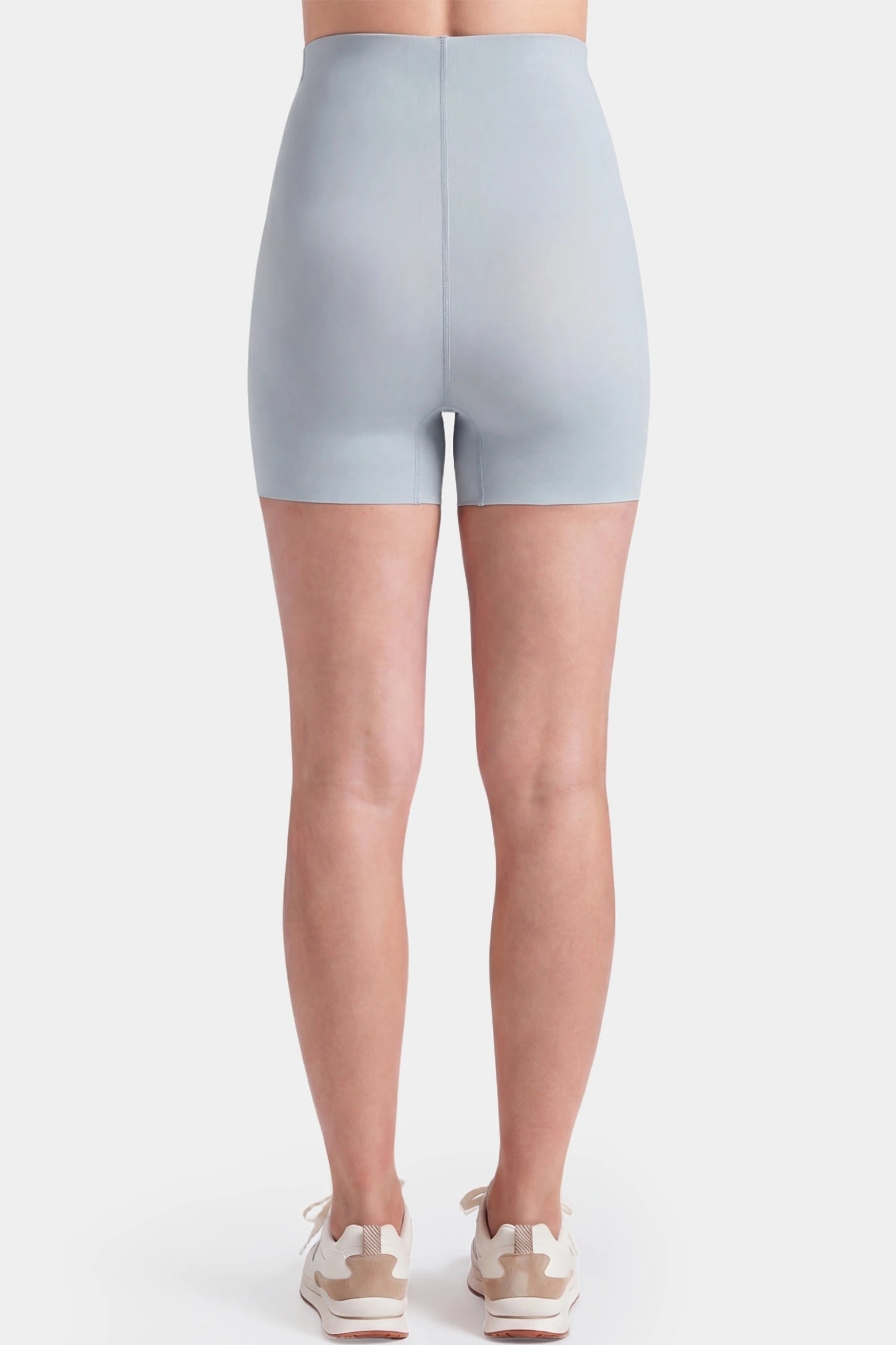 Seamless High-Waist Slim-fit Safety Maternity Shorts Seamless high-waist slim-fit maternity shorts in light gray with smooth rear contour, back view on pregnant model