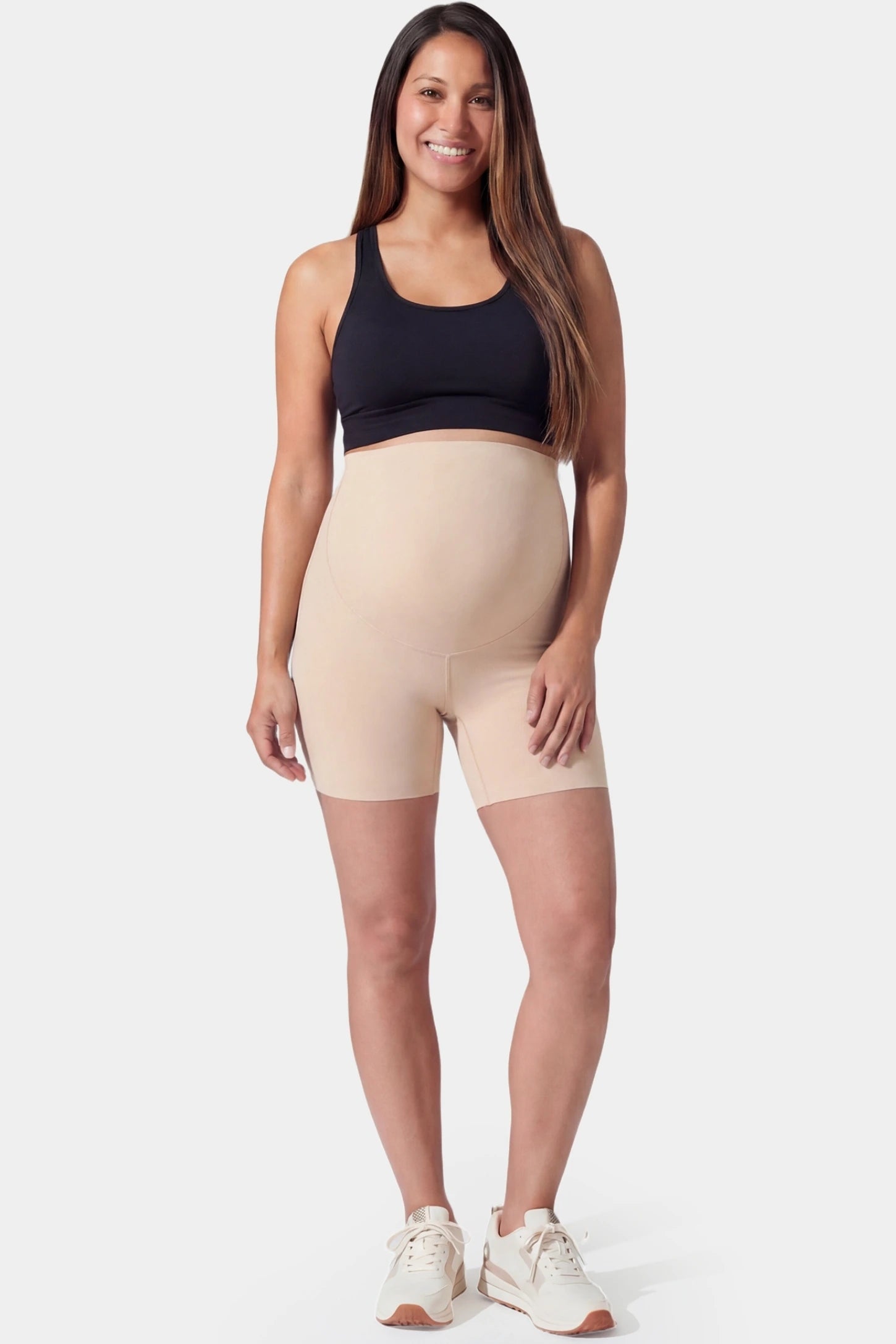 Seamless High-Waist Slim-fit Safety Maternity Shorts Seamless high-waist slim-fit maternity shorts in skin tone with anti-exposure coverage, full body on pregnant model